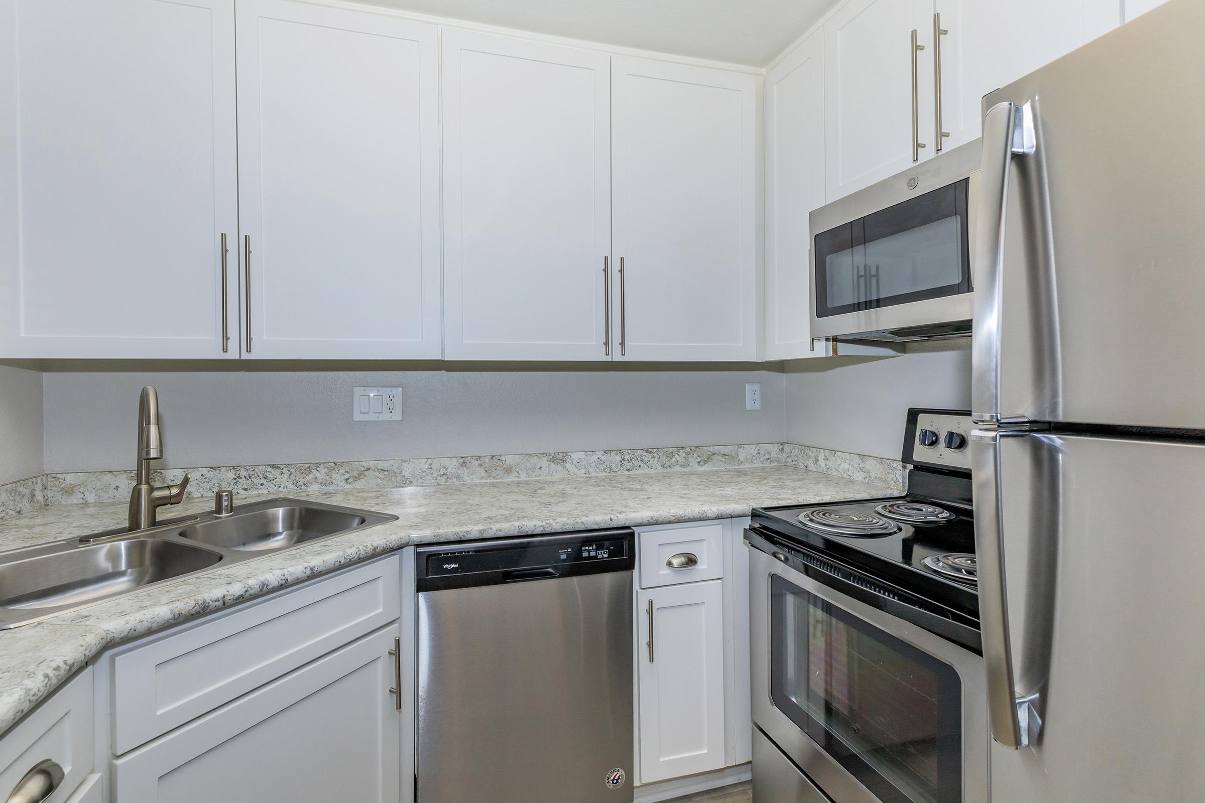 a kitchen with stainless steel appliances