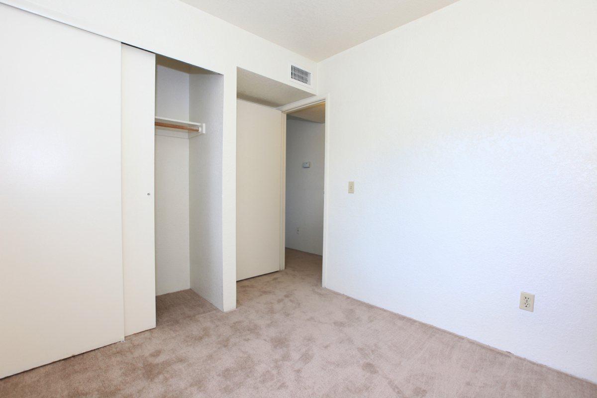 a white refrigerator freezer sitting inside of a building