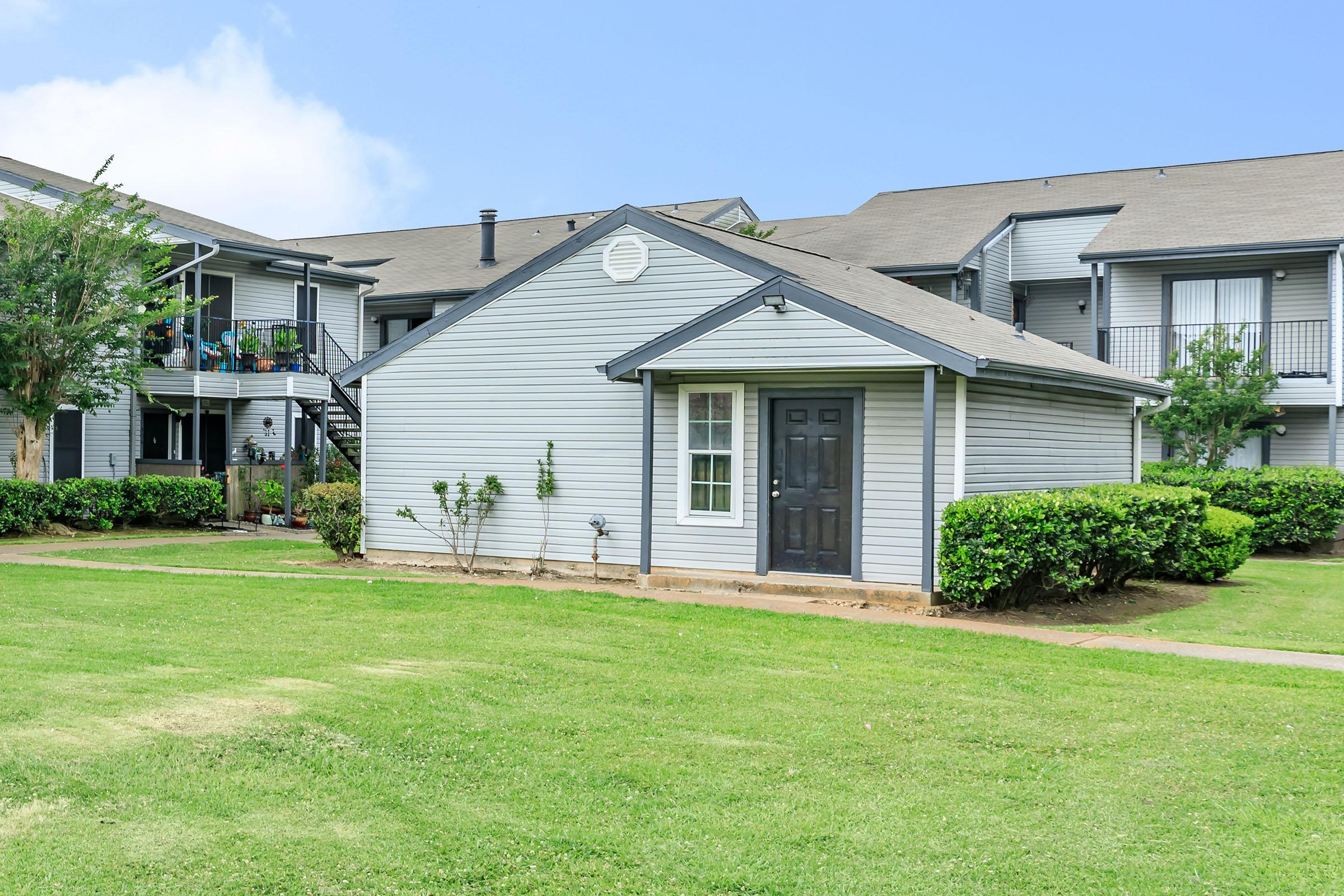 a large lawn in front of a house