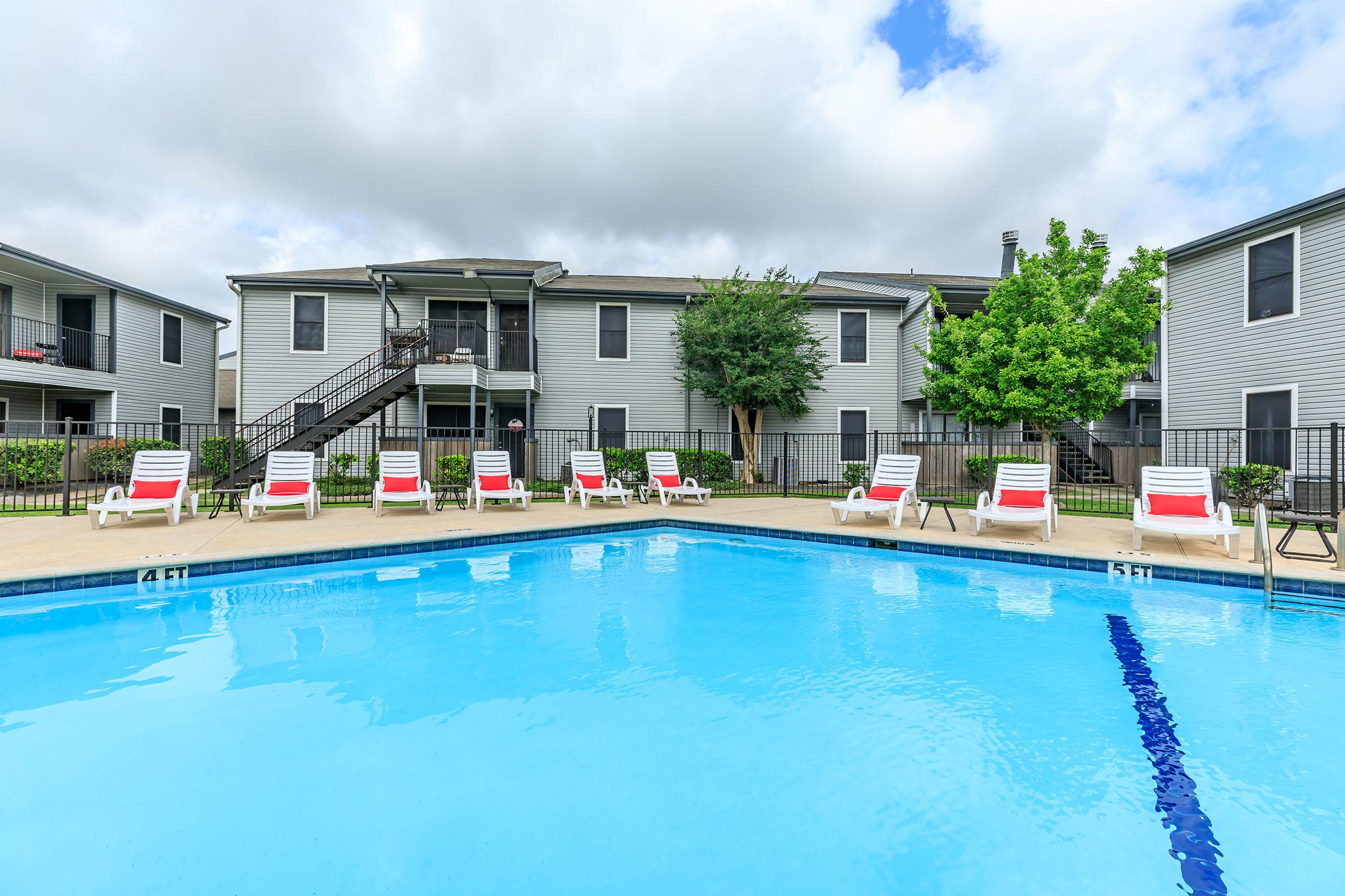 SOAK UP THE SUN BY THE SHIMMERING SWIMMING POOL IN LAKE JACKSON, TEXAS