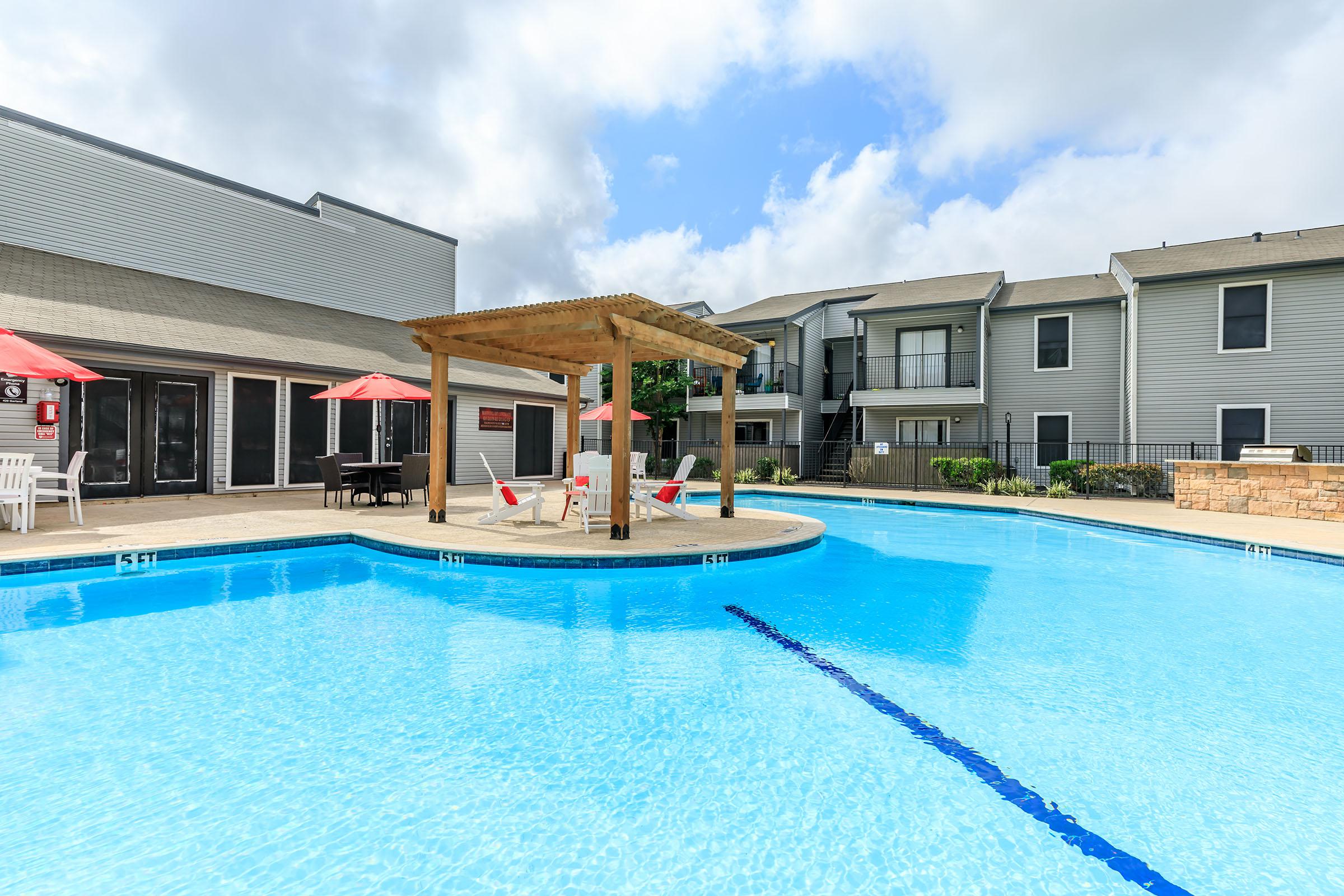 a house with a large pool of water