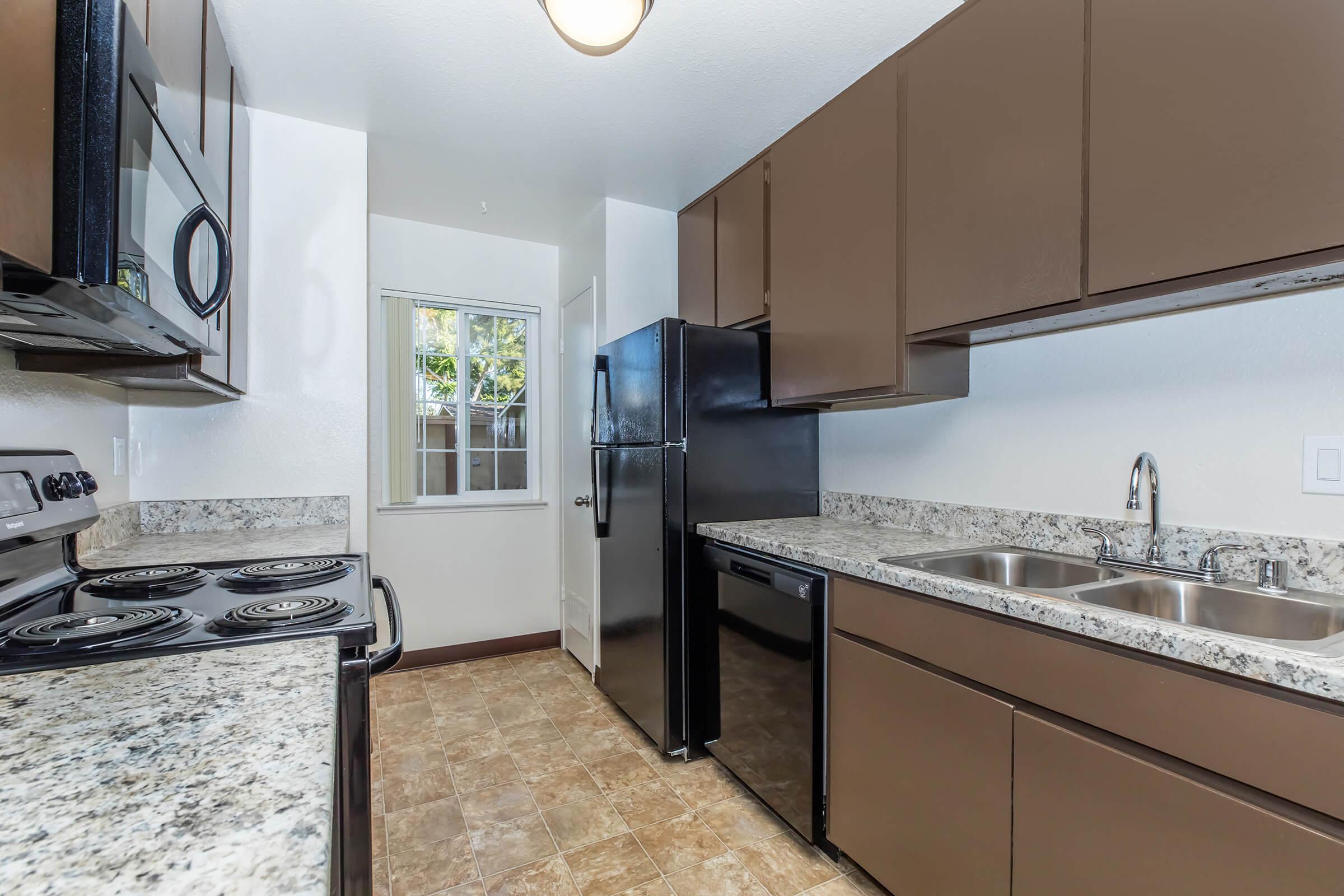 a large kitchen with stainless steel appliances