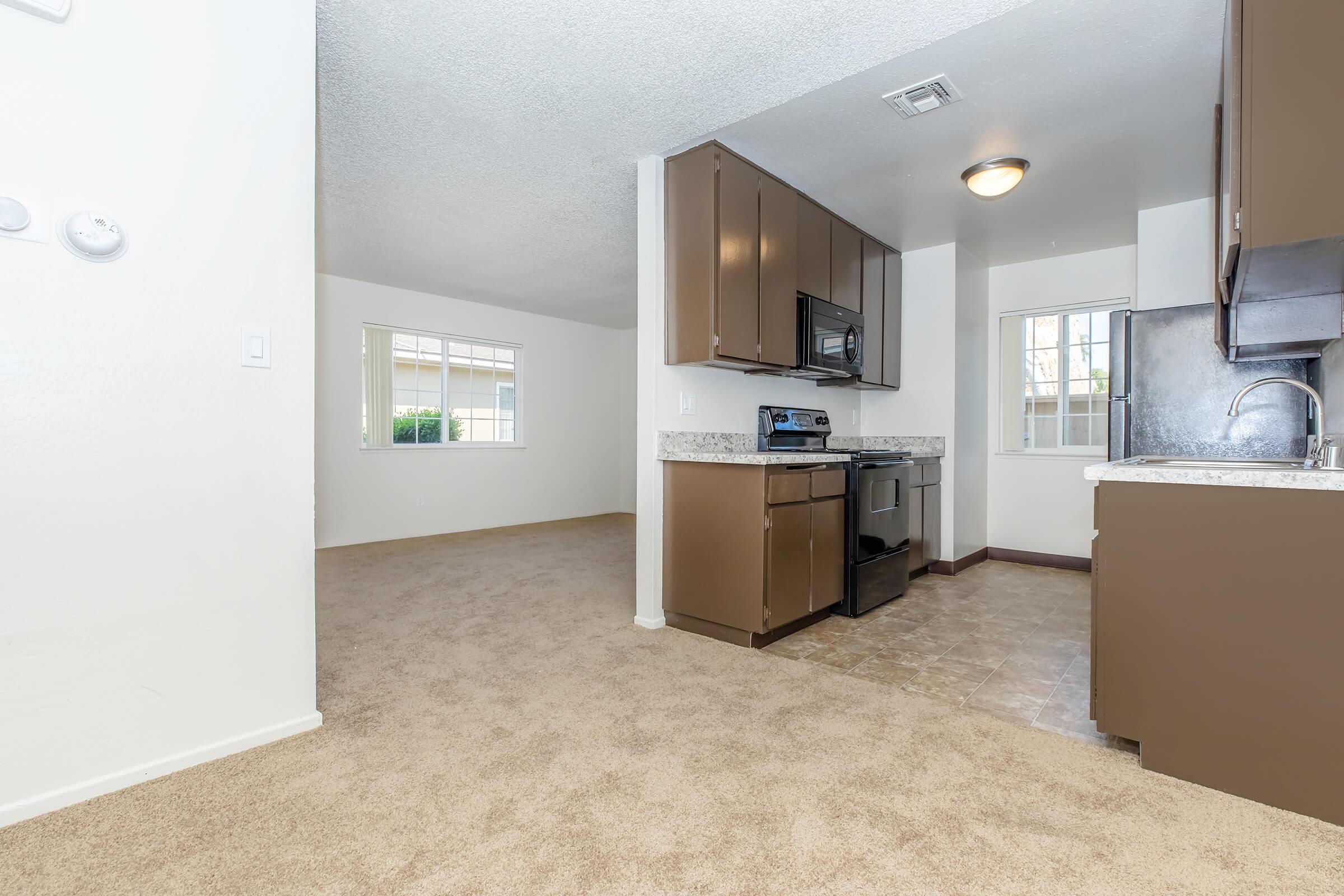 a kitchen with a sink and a refrigerator