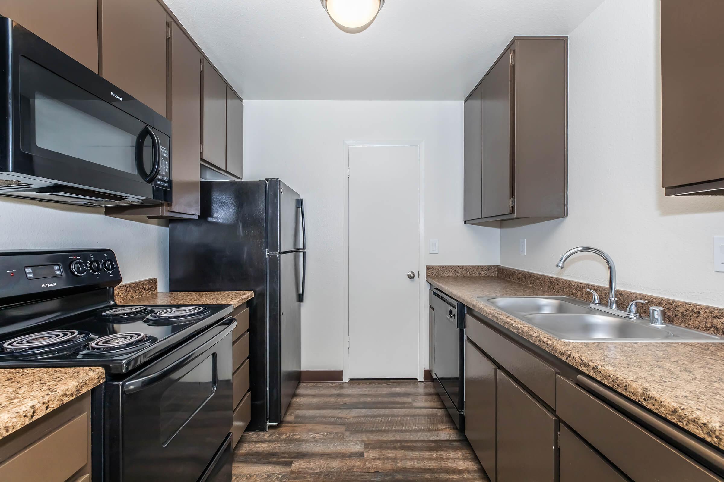 a modern kitchen with stainless steel appliances