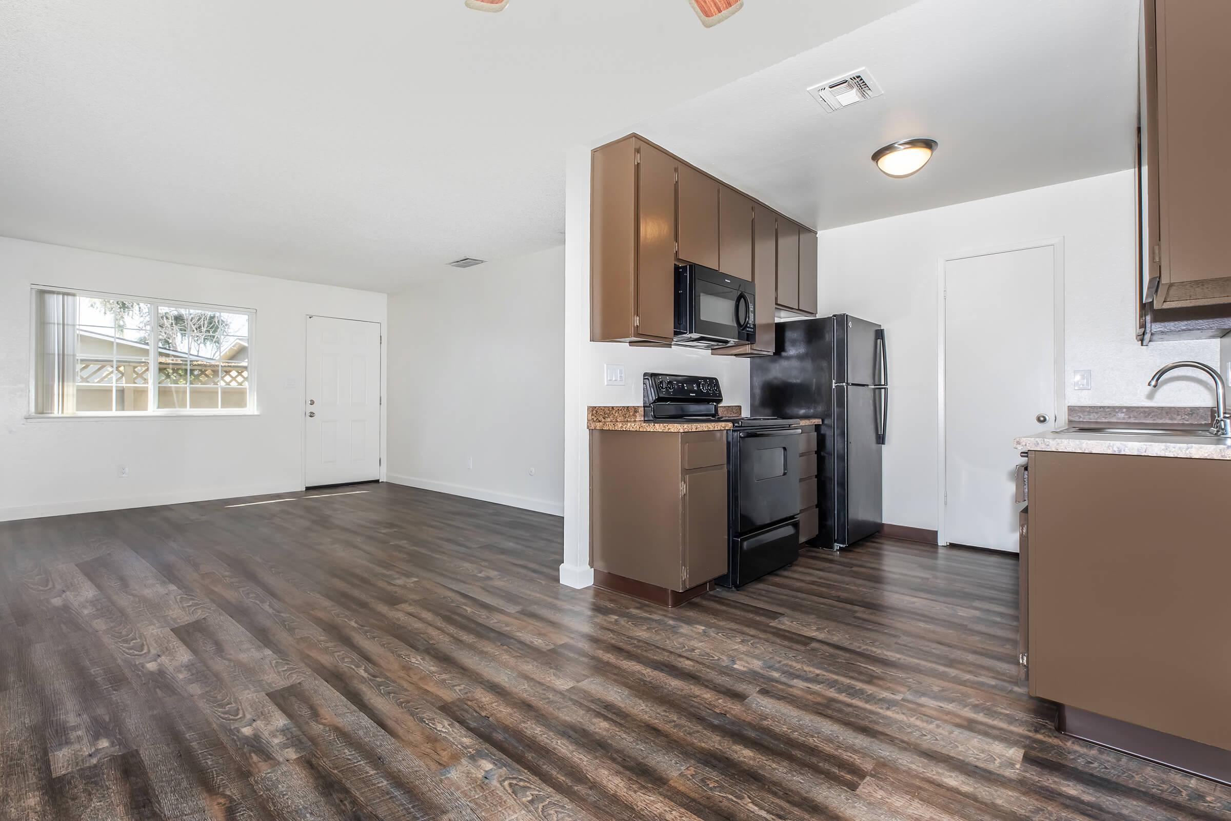 a kitchen area with a building in the background