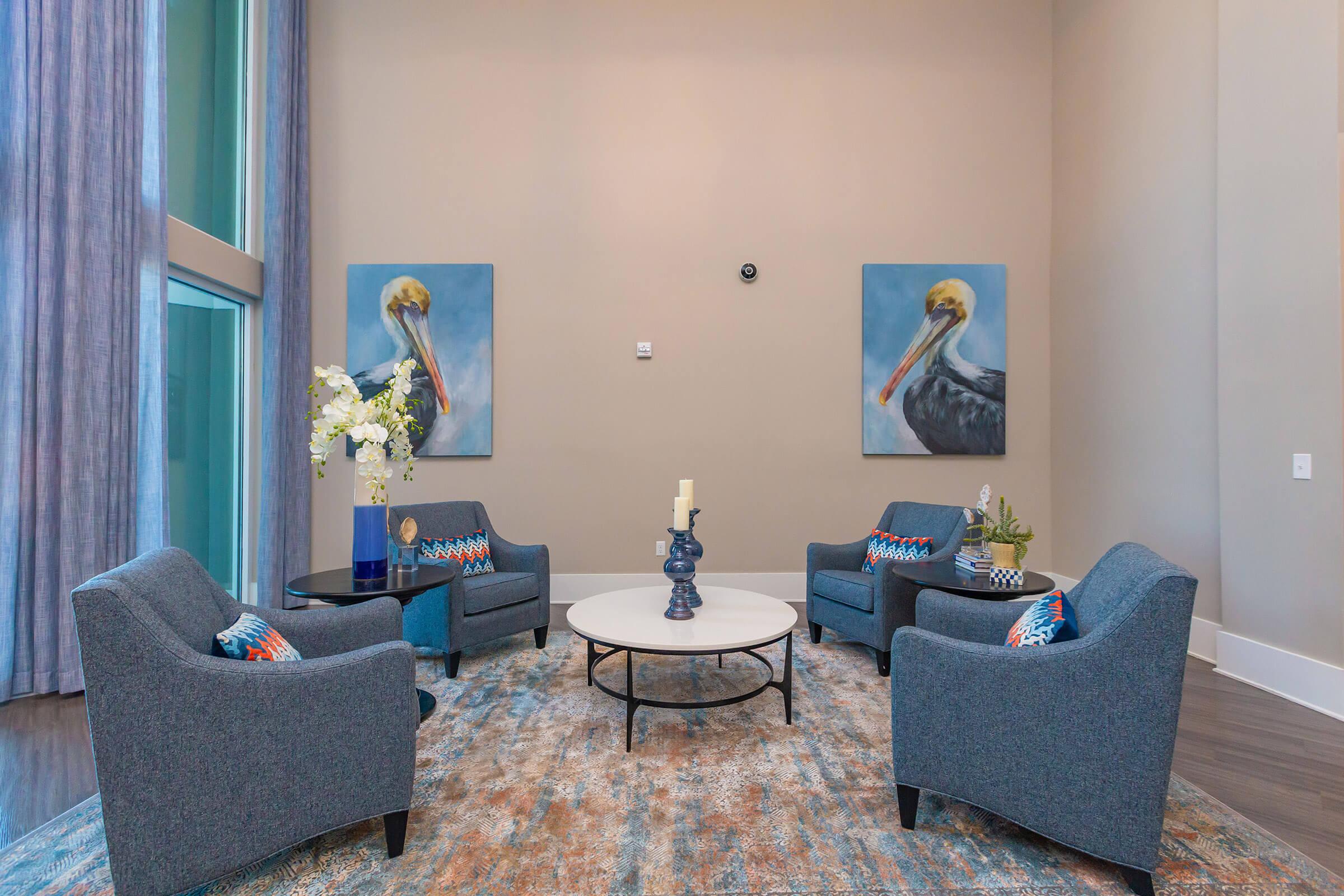 a living room filled with furniture and a window