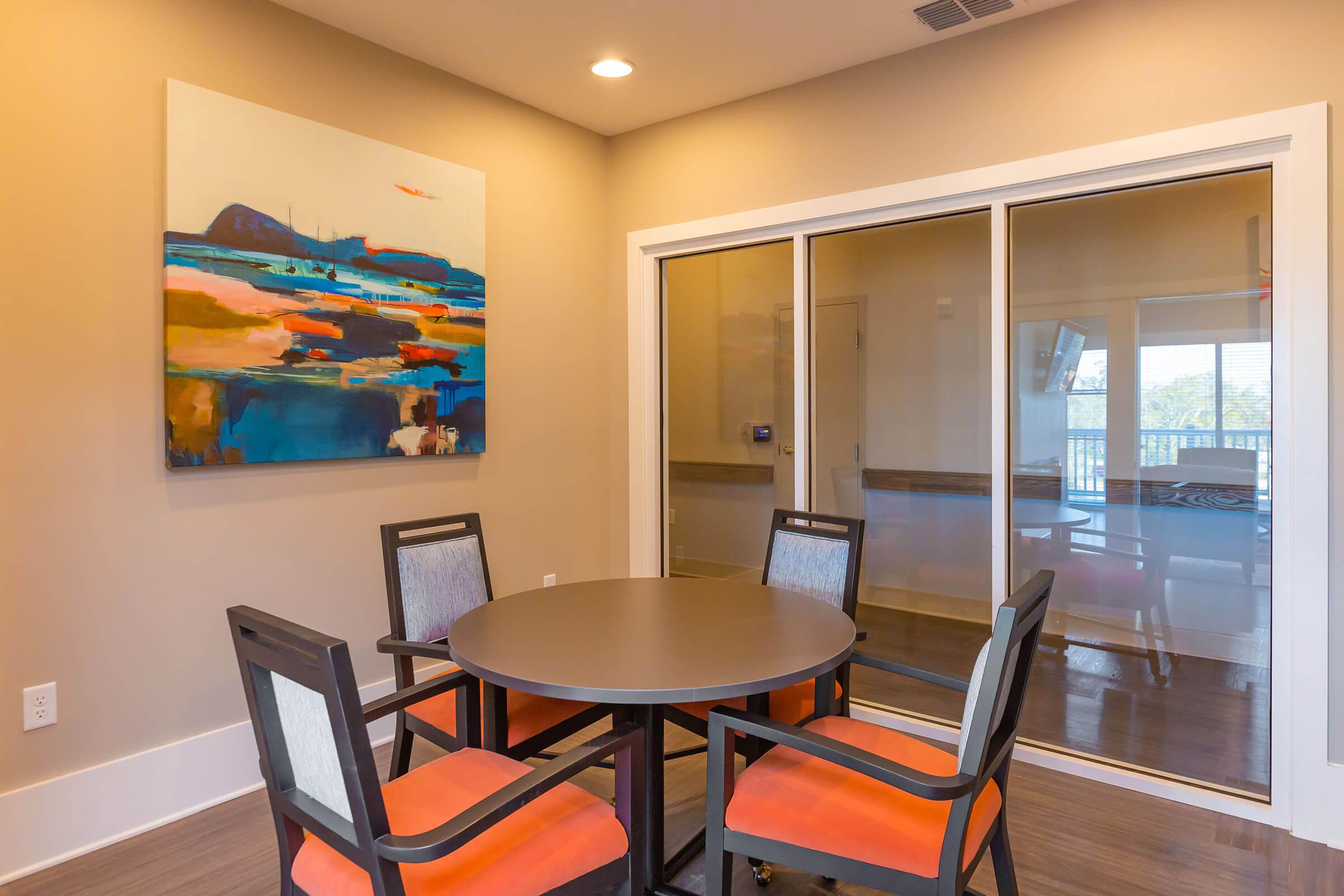 a dining room table in front of a window