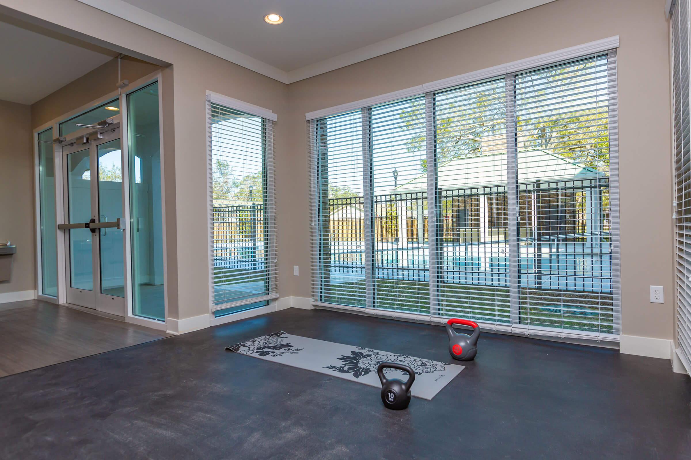 a living room filled with furniture and a large window