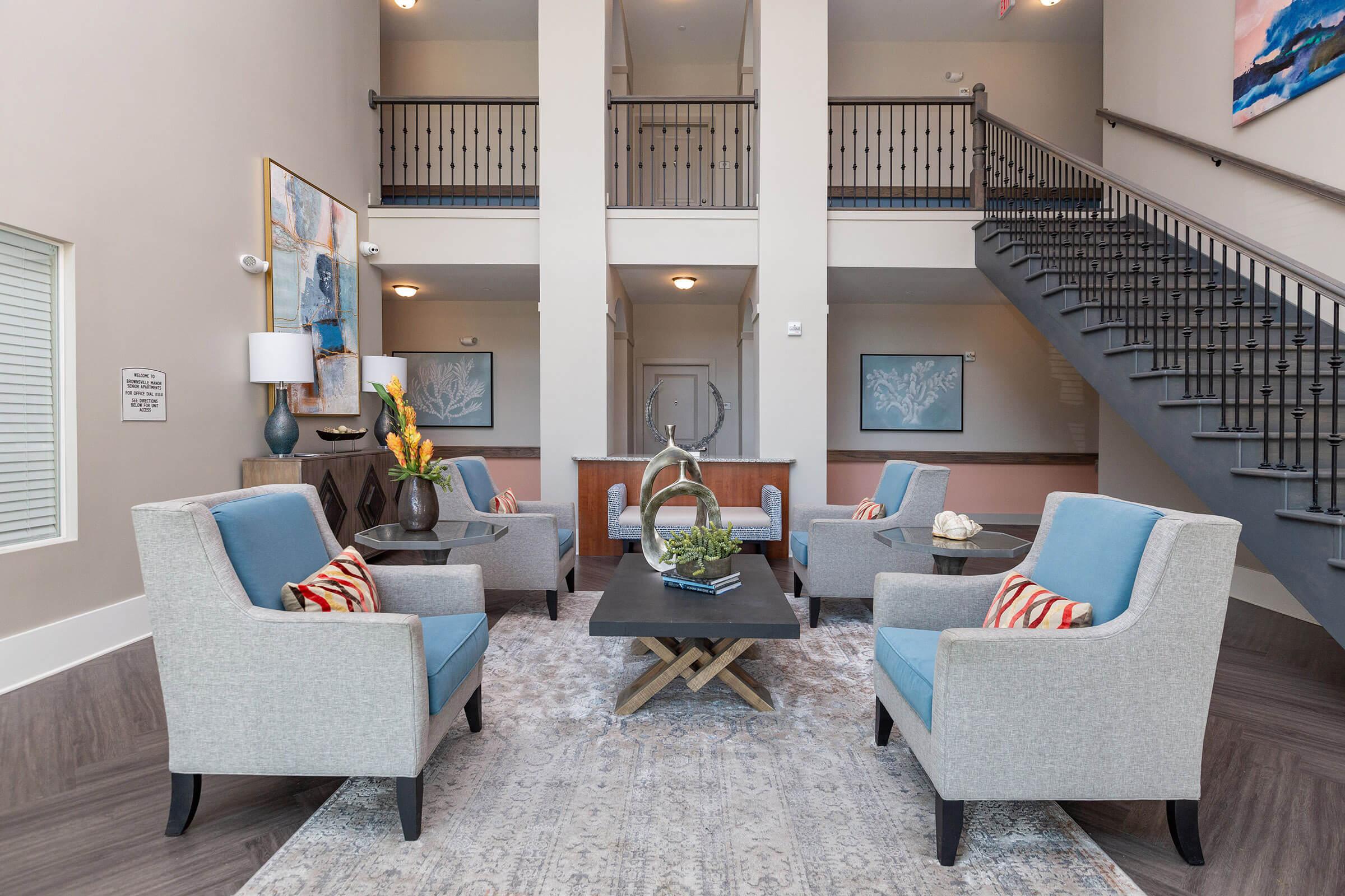 a living room filled with furniture and a table