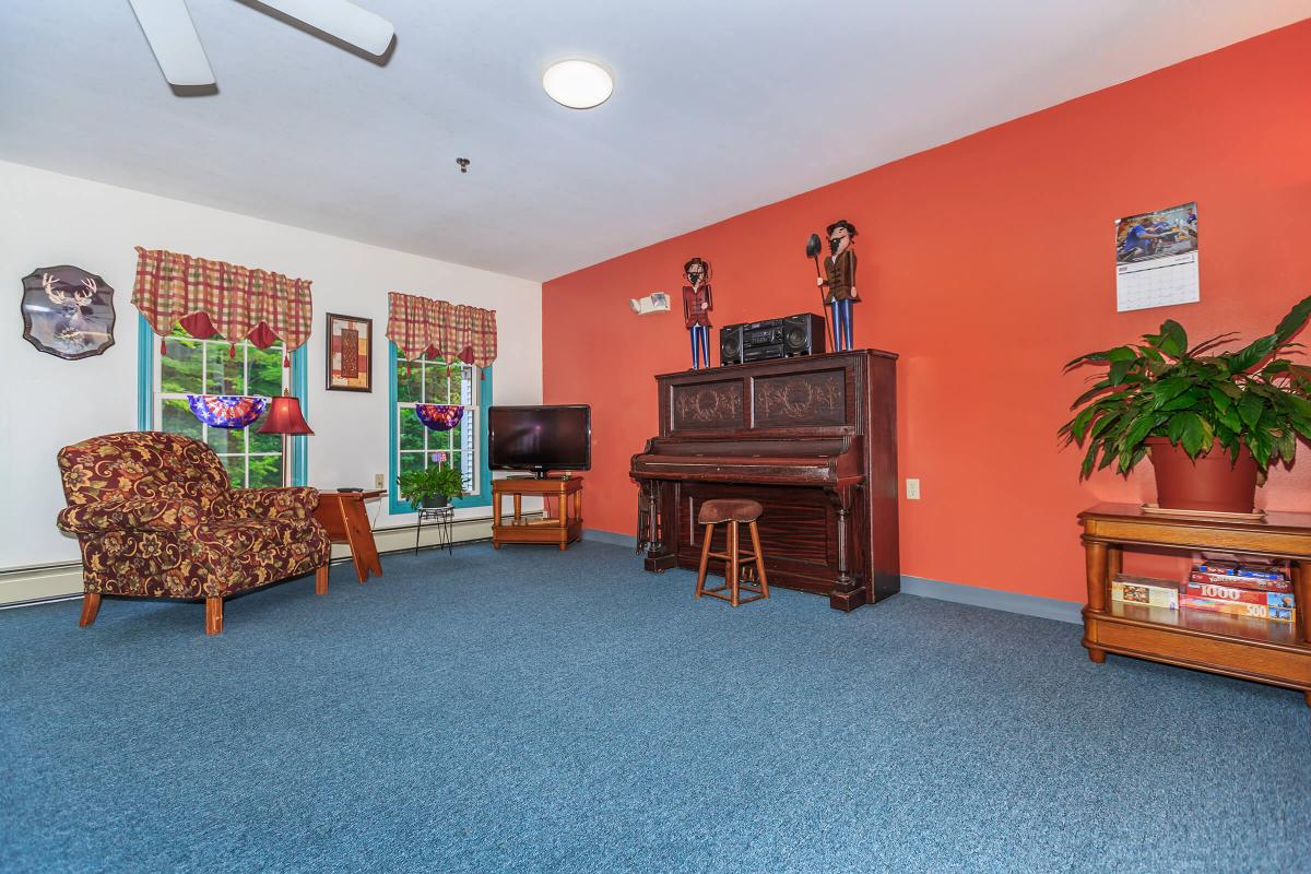 a living room filled with furniture and a flat screen tv