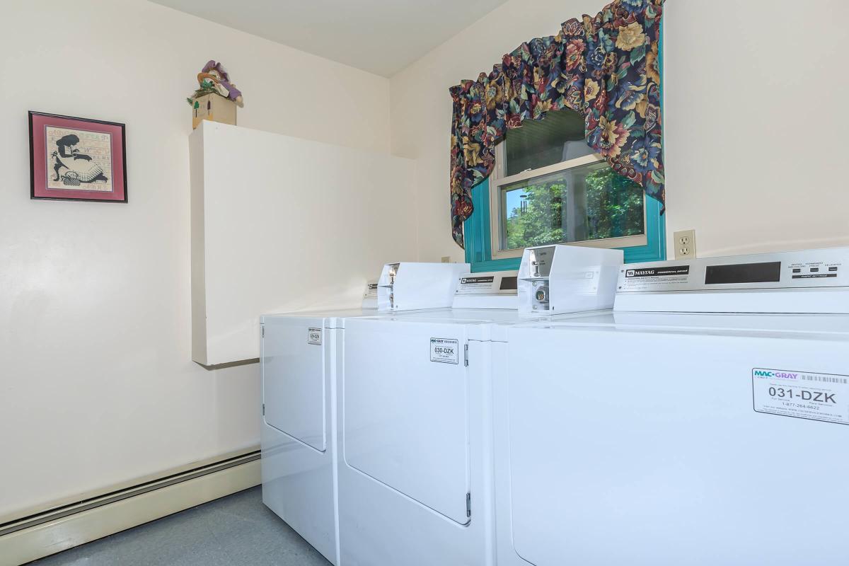 a white refrigerator freezer sitting in a room