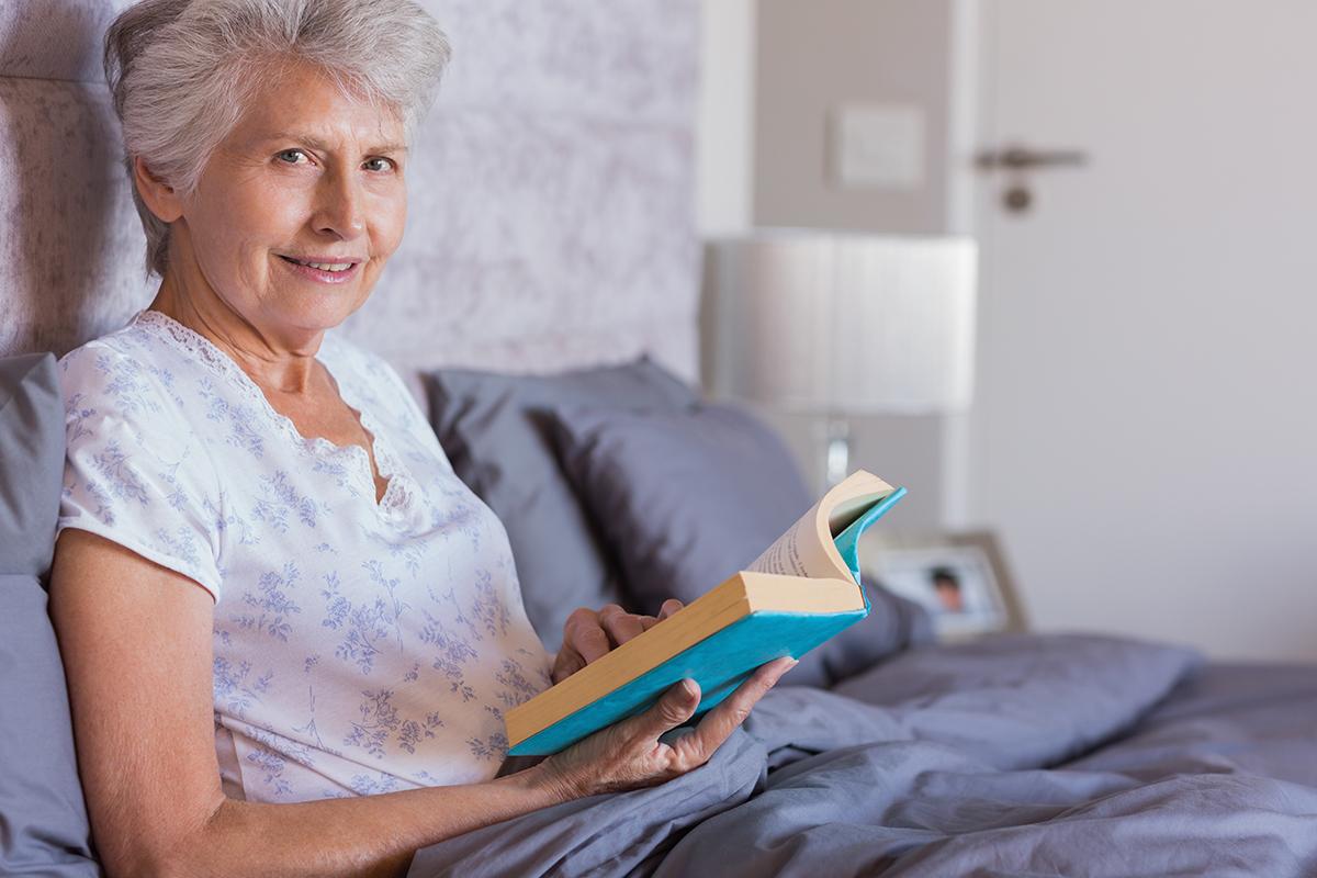 a woman sitting on a bed