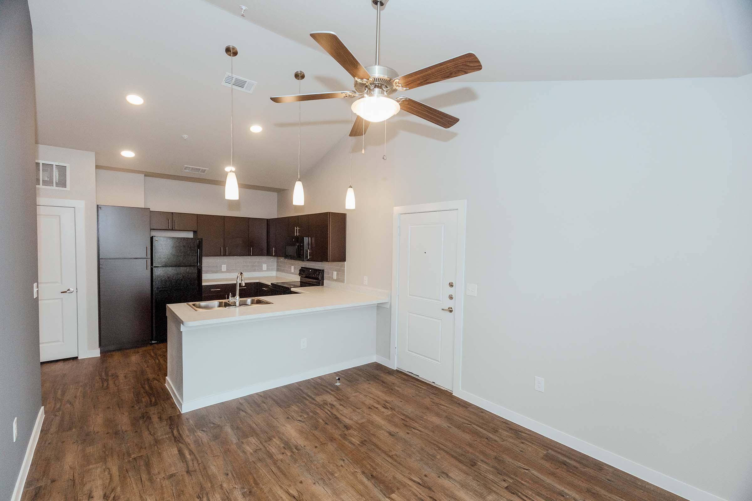 a kitchen with a sink and a mirror