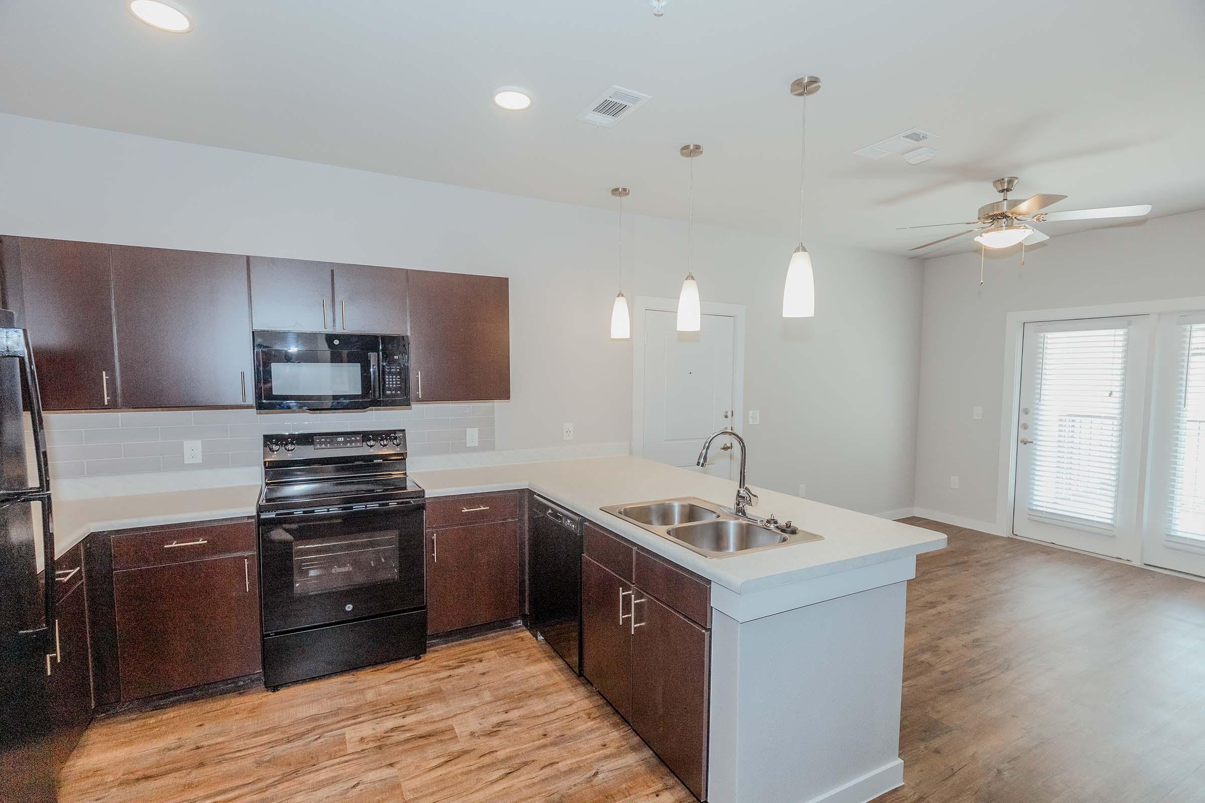 a kitchen with a stove and a sink