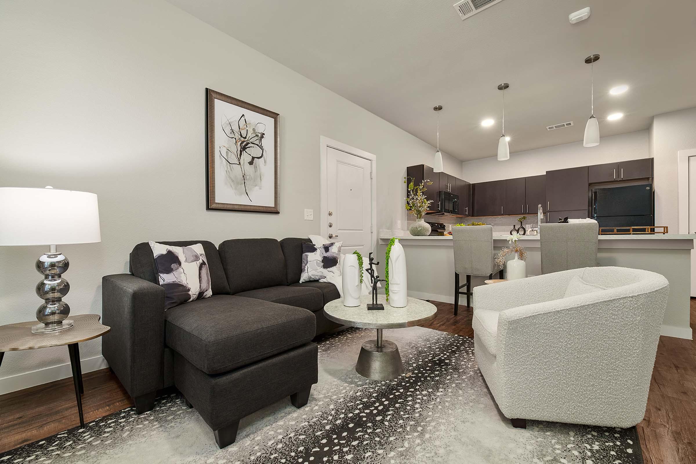 a living room filled with furniture and a flat screen tv