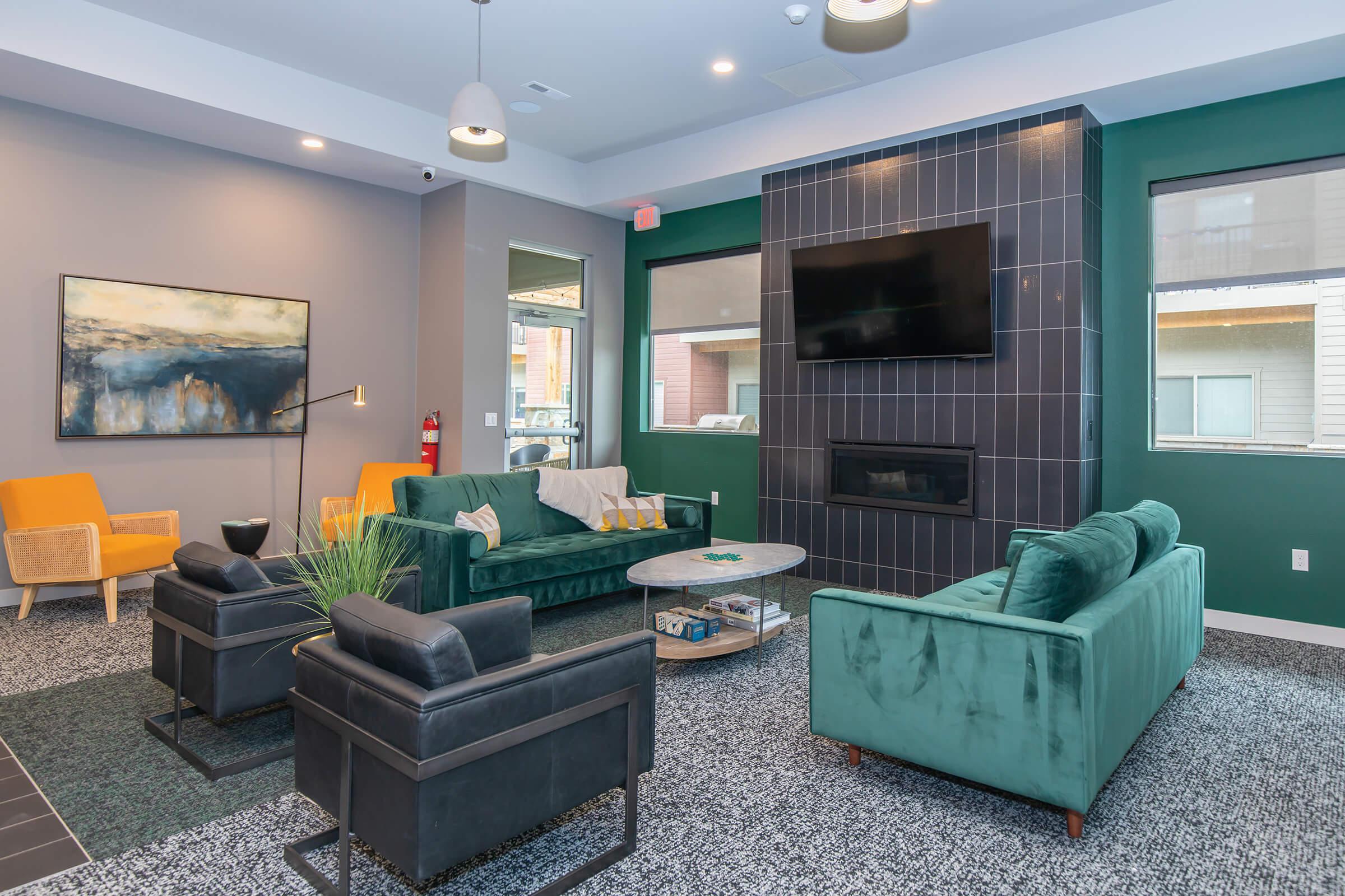 a living room filled with furniture and a large window