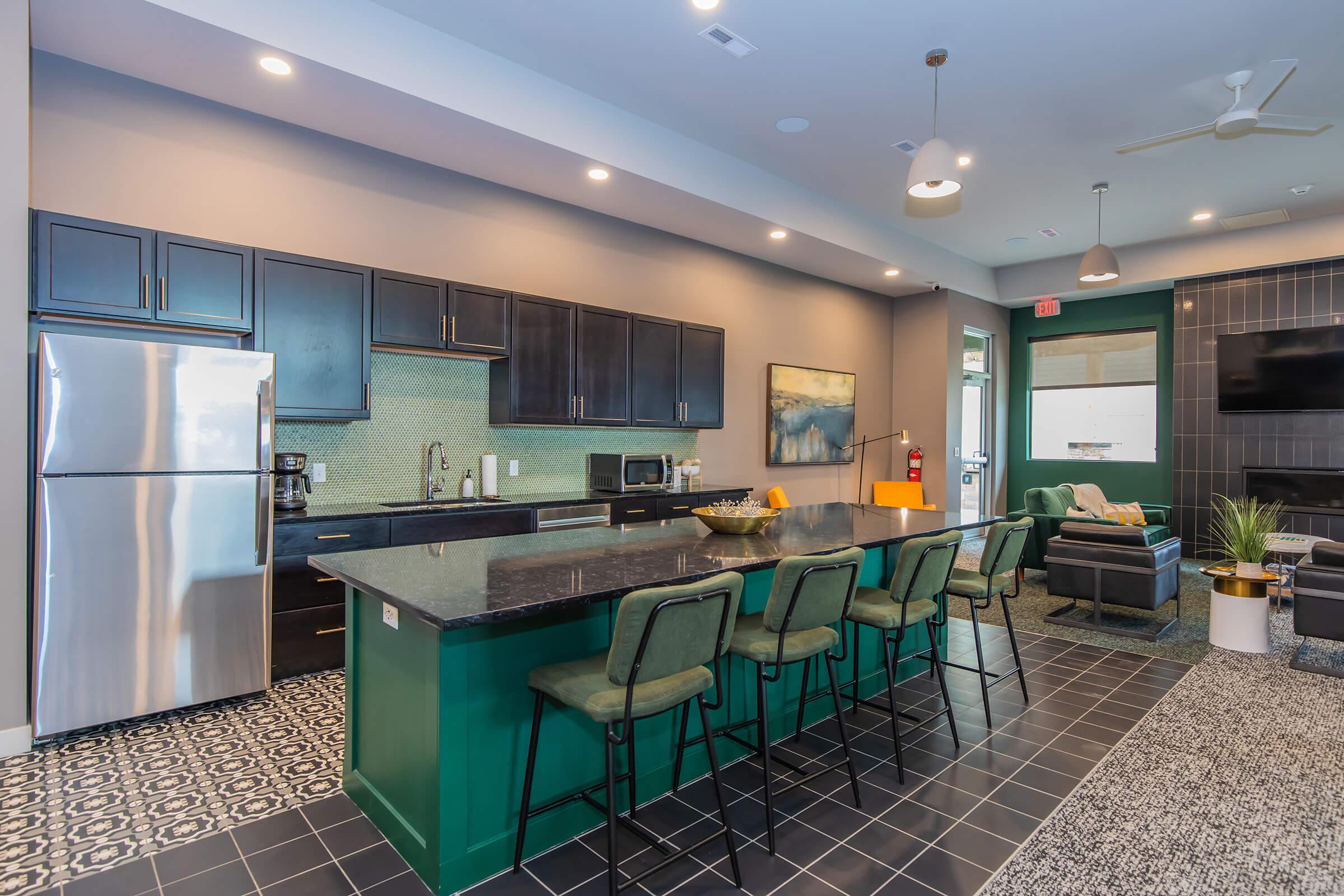 a kitchen with a blue chair