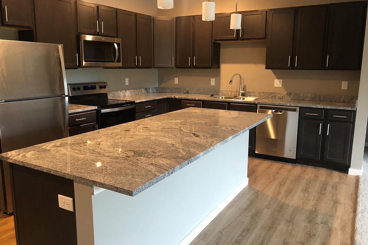 a modern kitchen with stainless steel appliances