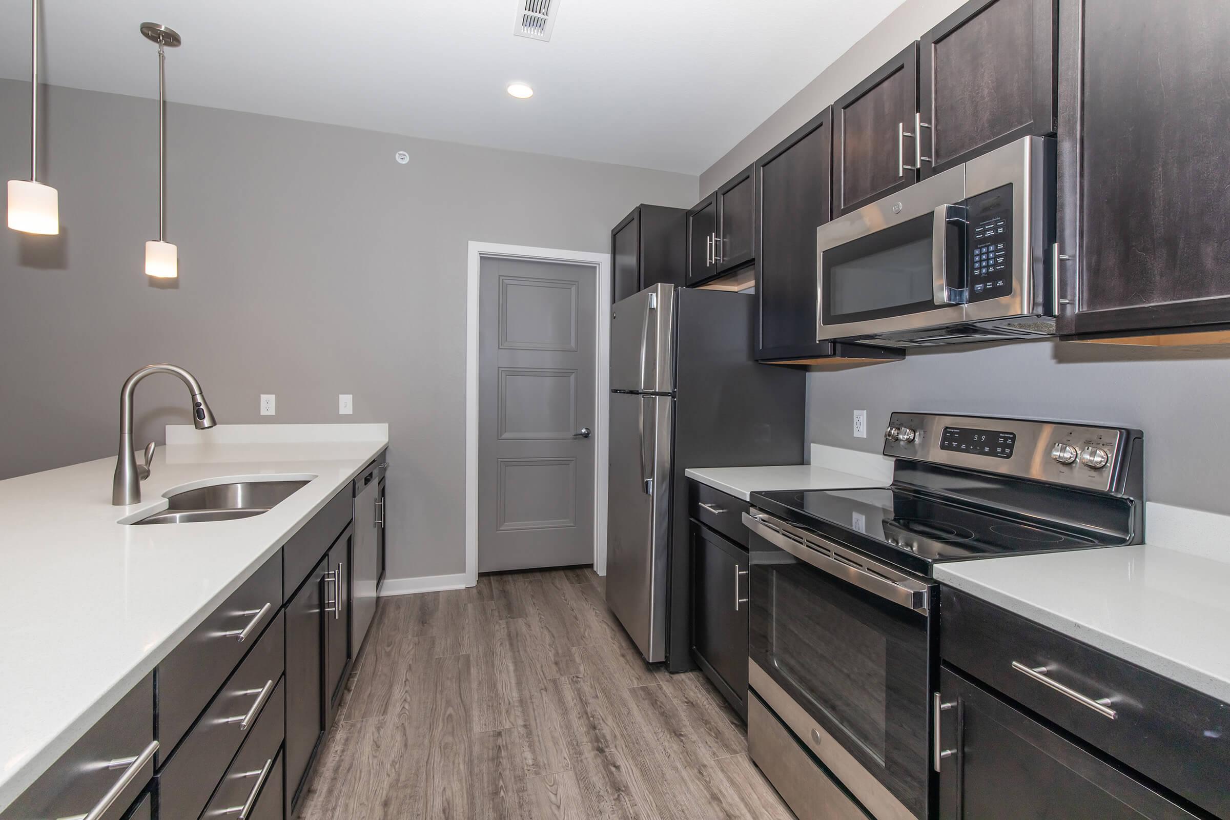 a large kitchen with stainless steel appliances