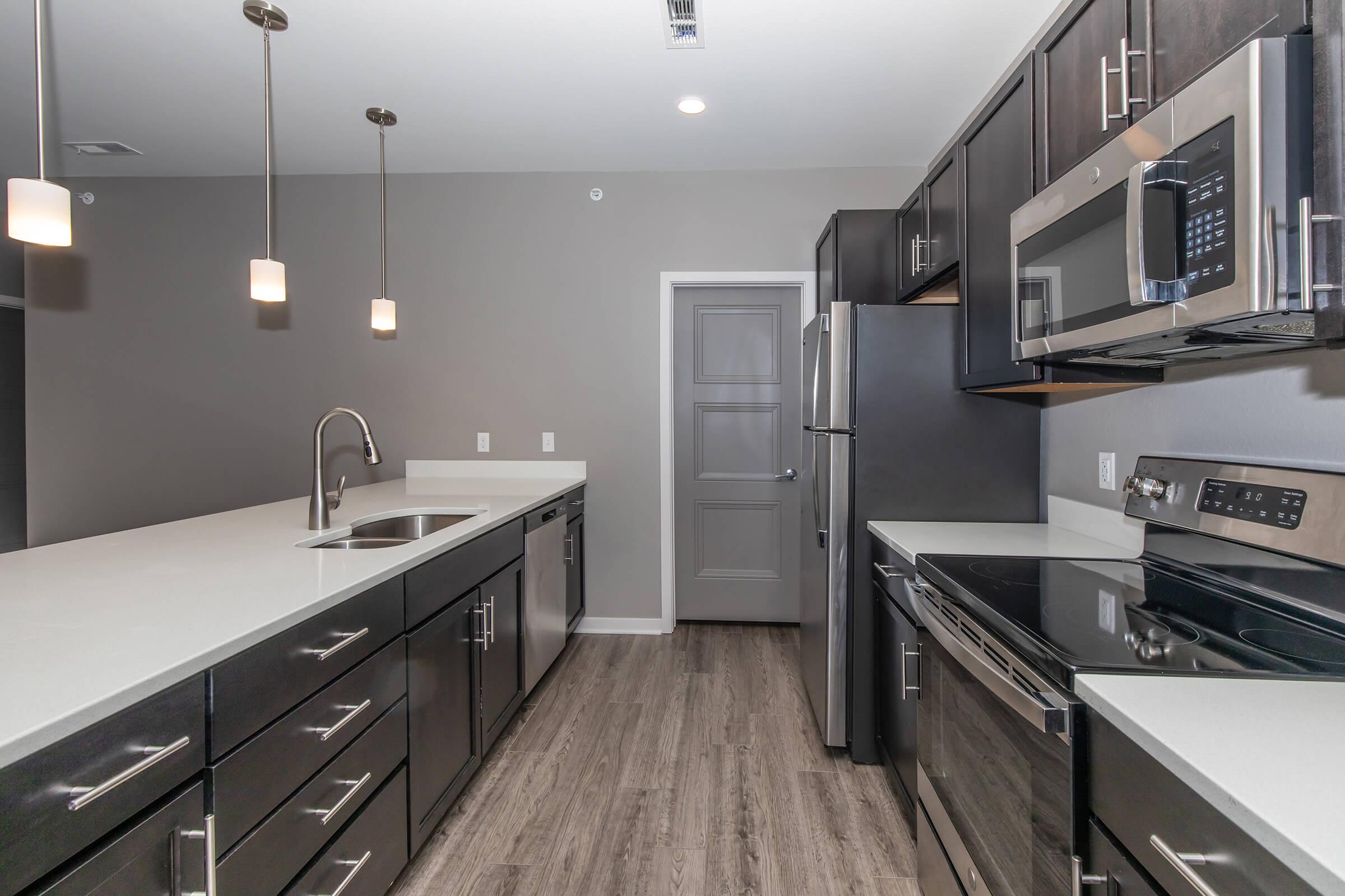 a modern kitchen with stainless steel appliances