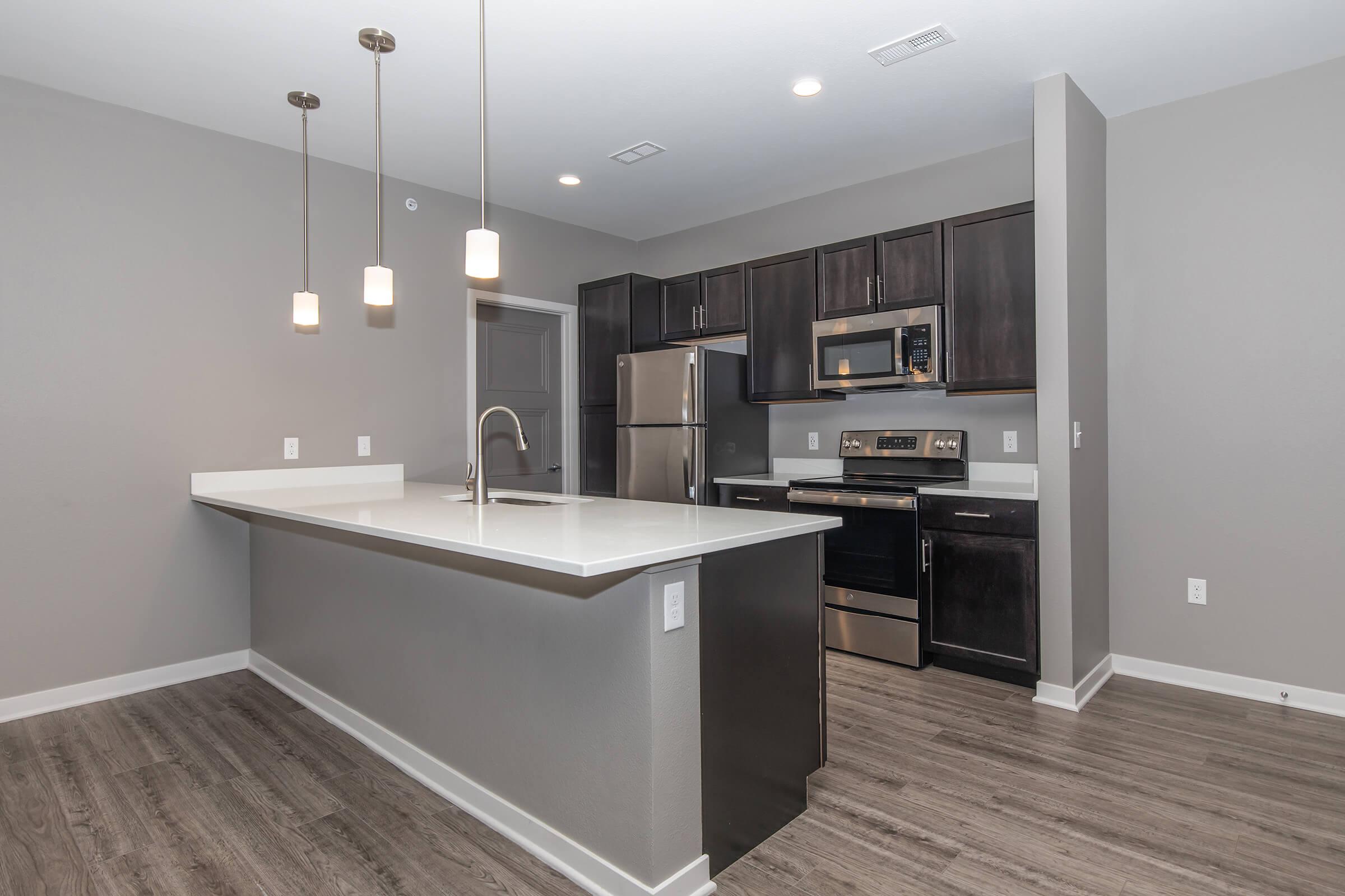 a kitchen with a table in a room