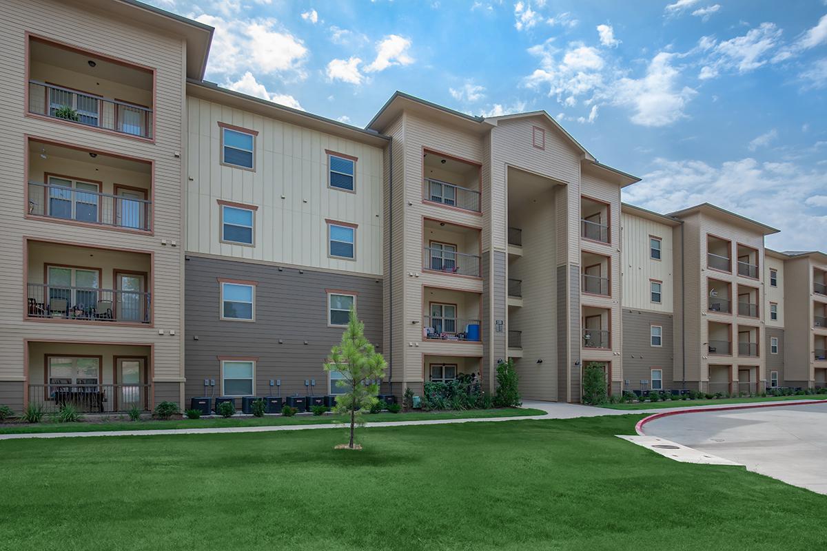 a large lawn in front of a building