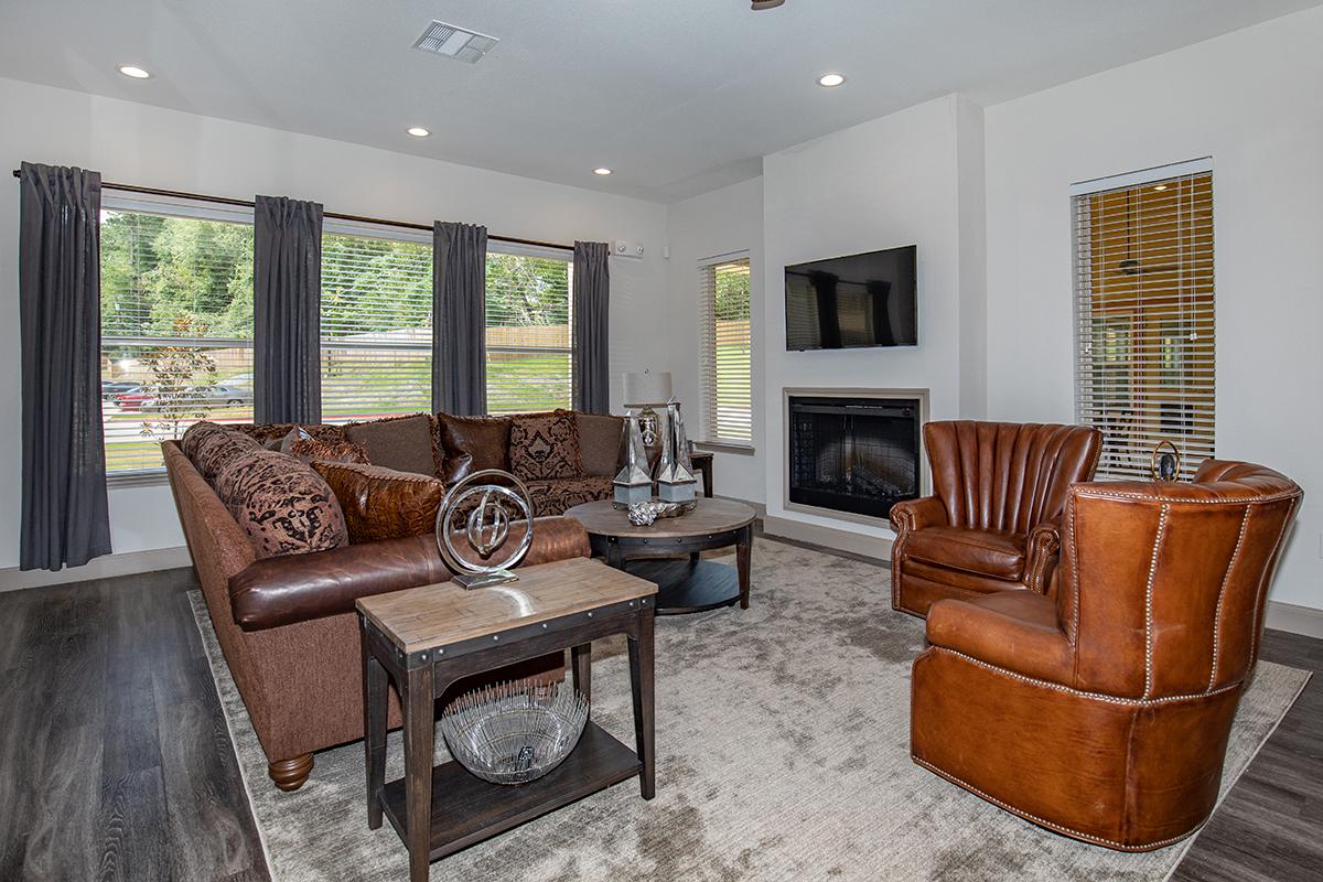 a living room filled with furniture and a fireplace