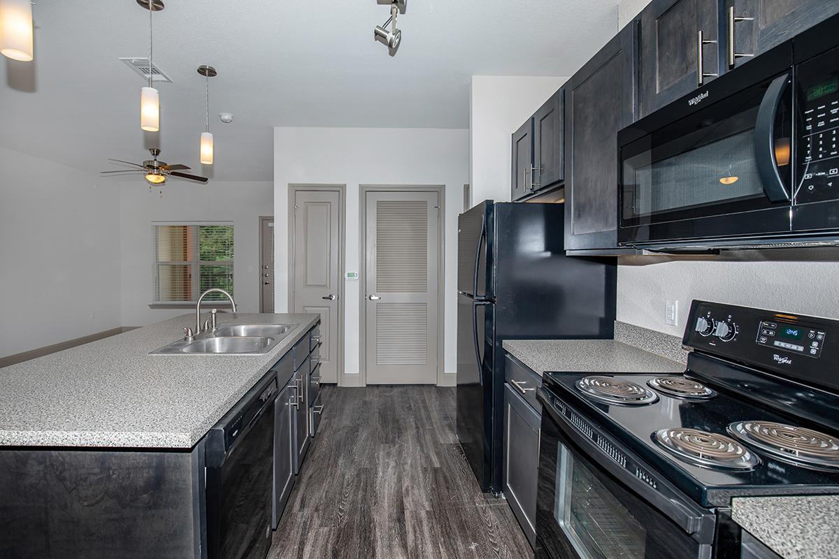 a modern kitchen with stainless steel appliances