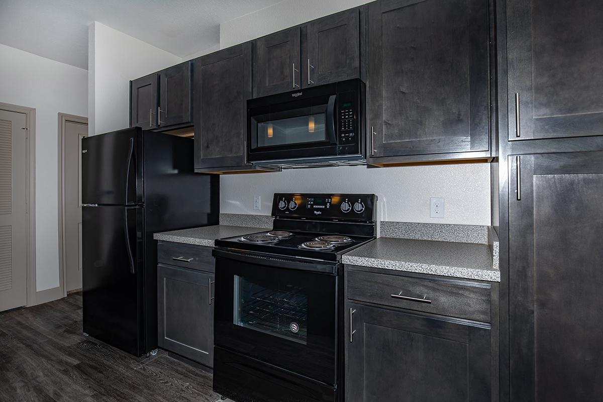 a large kitchen with stainless steel appliances