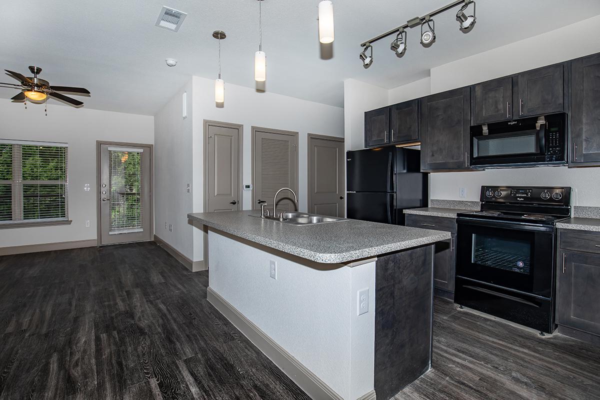 a kitchen with a stove and a sink