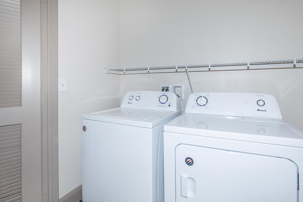 a white refrigerator freezer sitting in a room