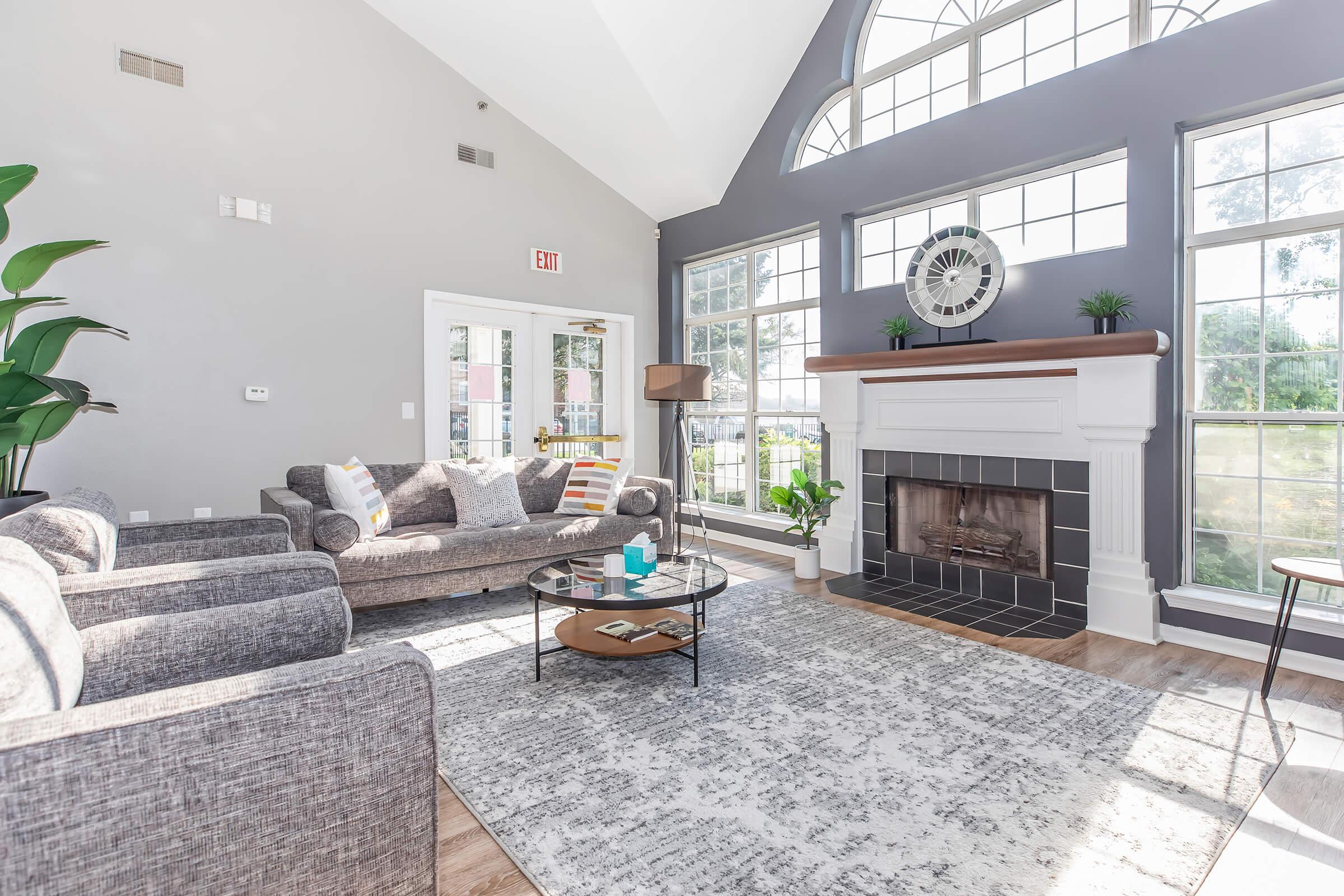 a living room filled with furniture and a fireplace