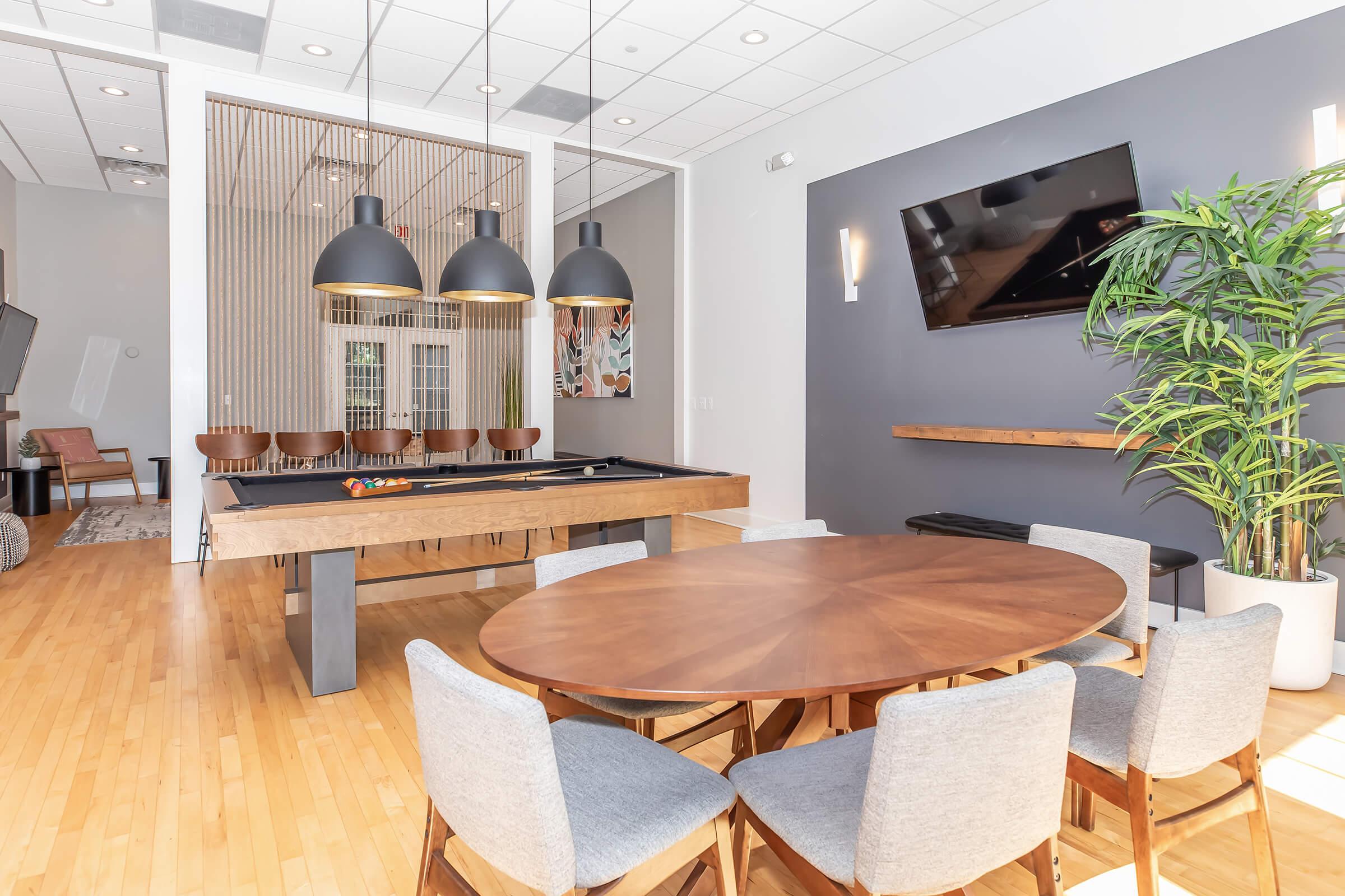 a room filled with furniture on top of a wooden table