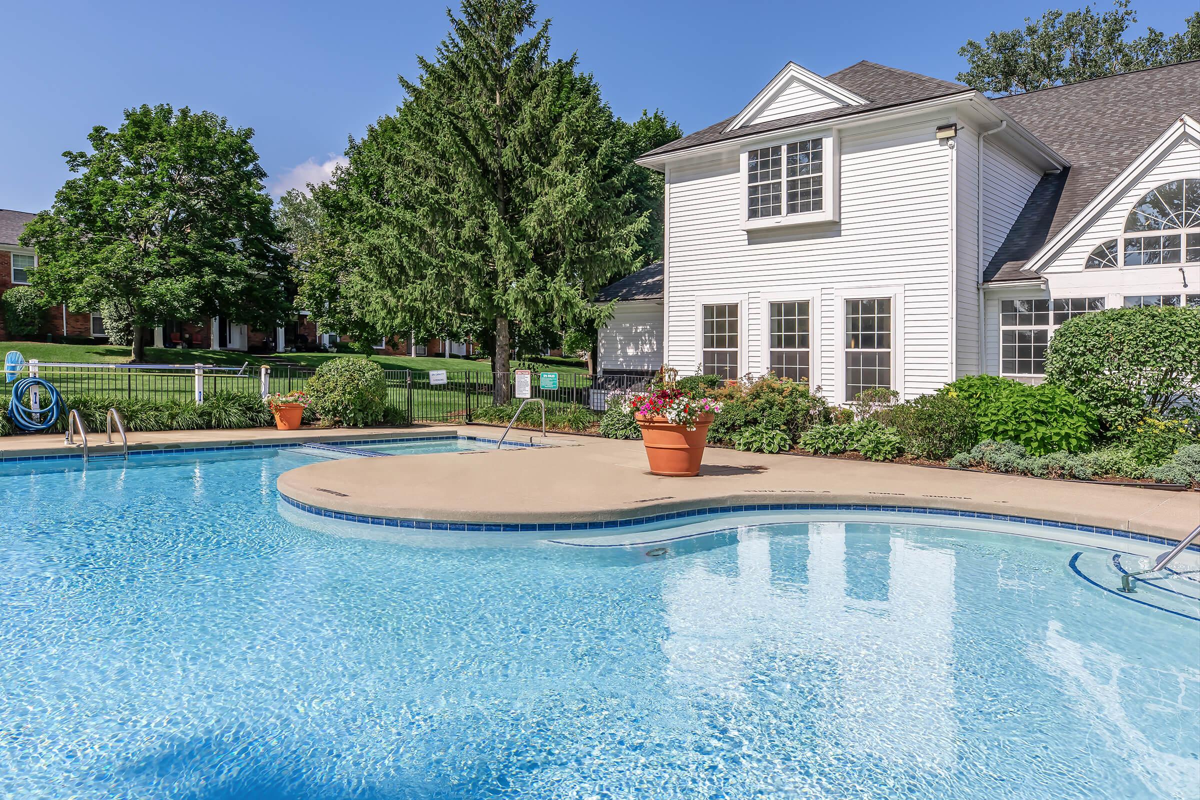 a house with a large pool of water