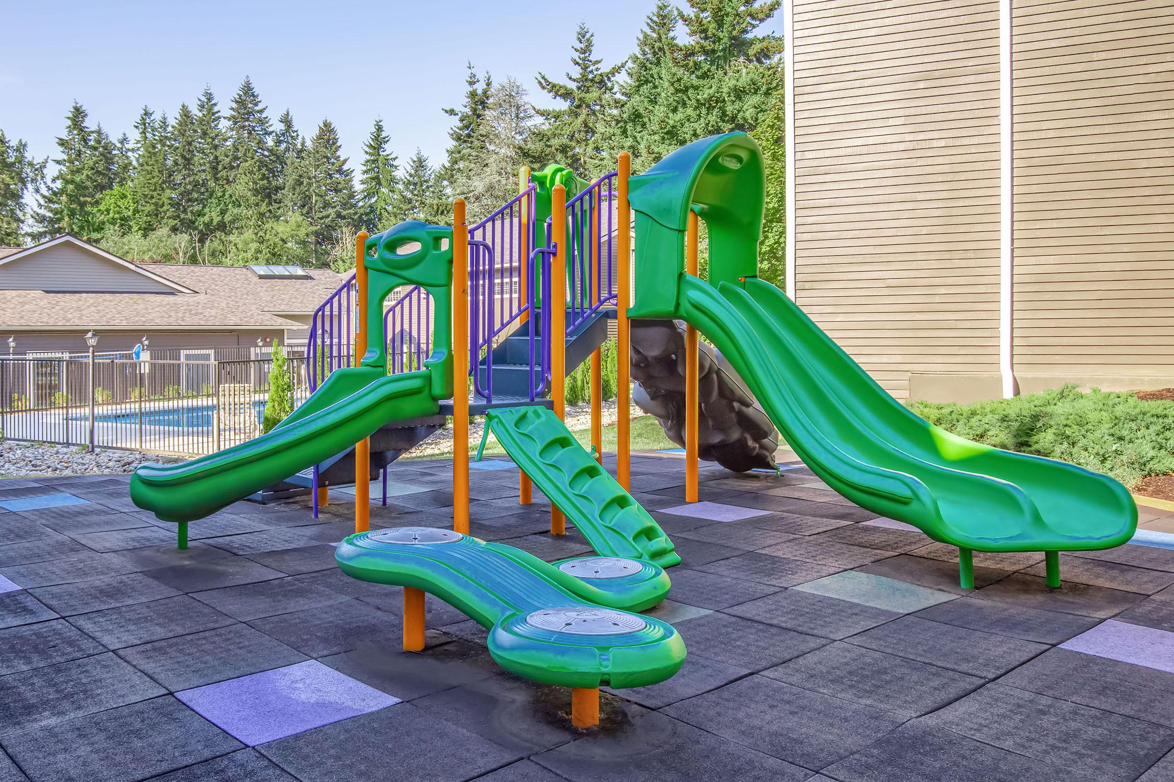 a green lawn chair on a playground