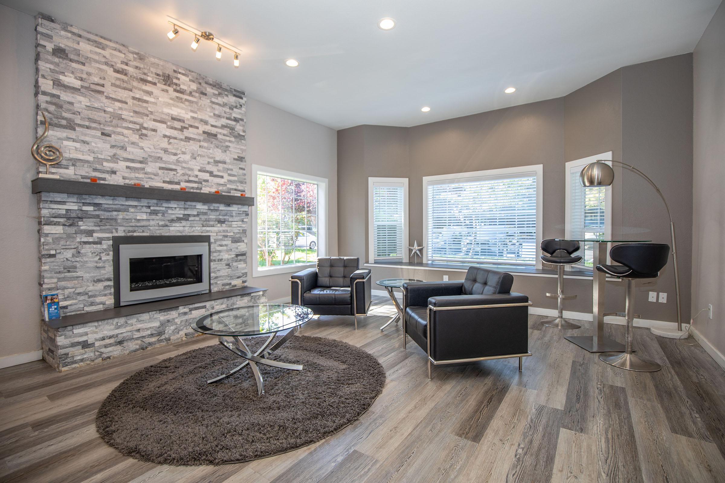 a living room filled with furniture and a flat screen tv