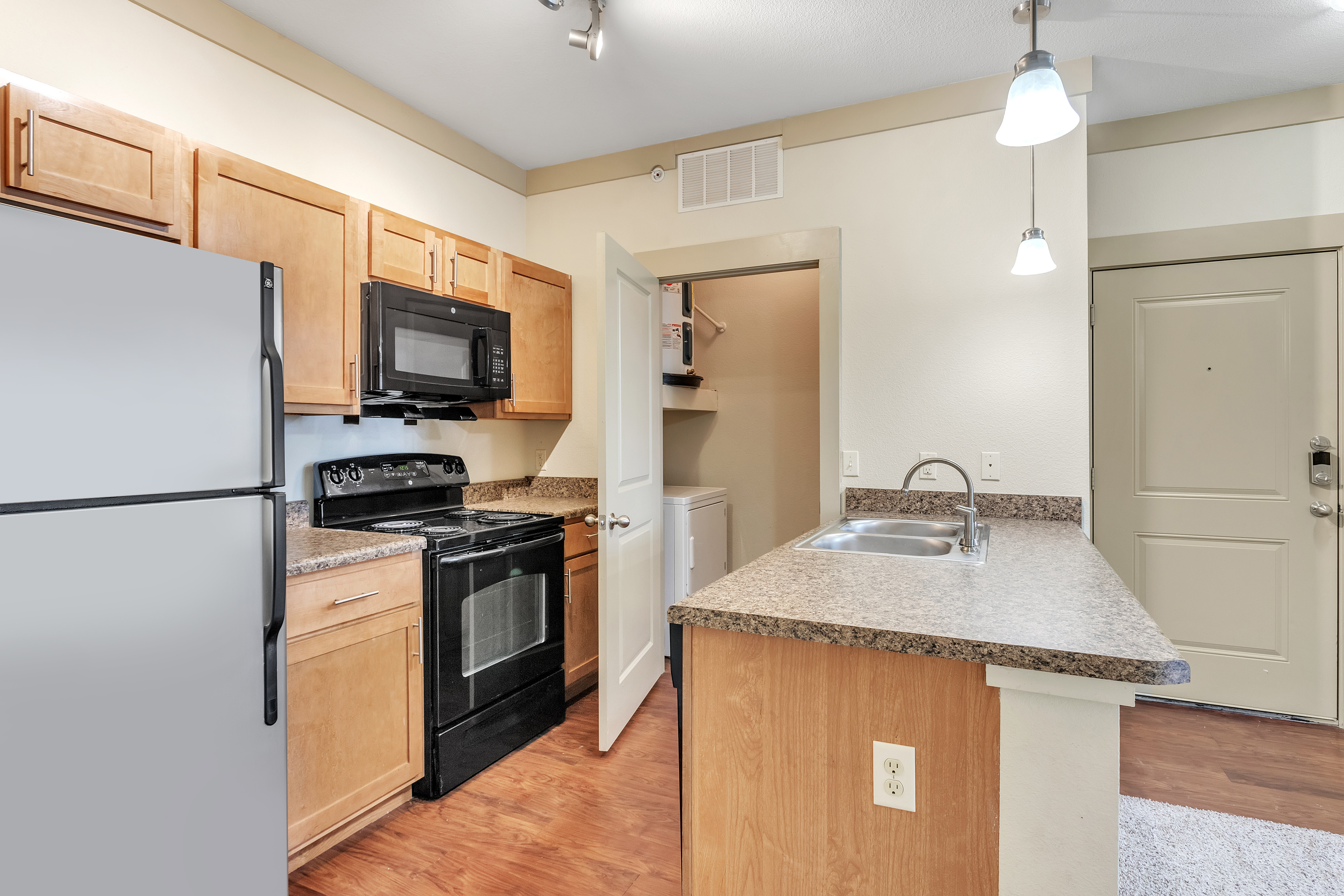 Kitchen with microwave  Riverside at Rockwater Luxury Apartments North Little Rock Arkansas 72114 