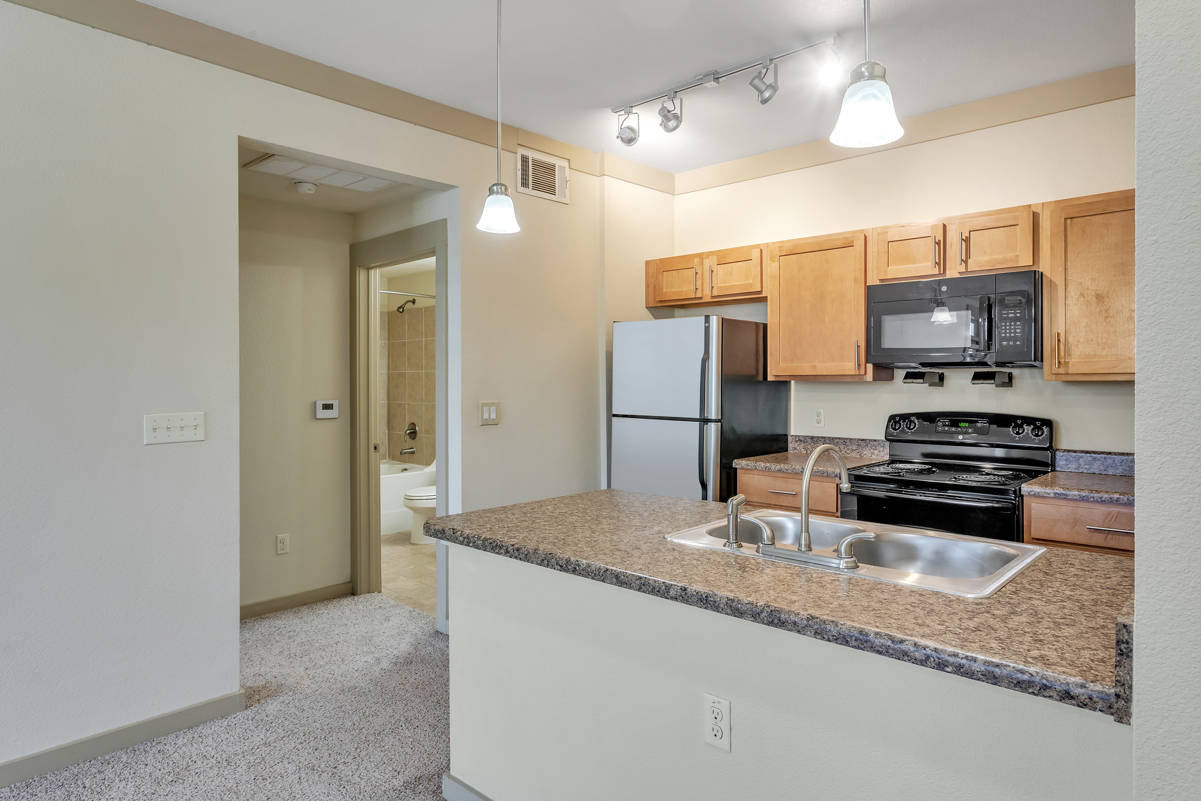 Kitchen view with stainless appliances Riverside at Rockwater Luxury Apartments  North Little Rock A