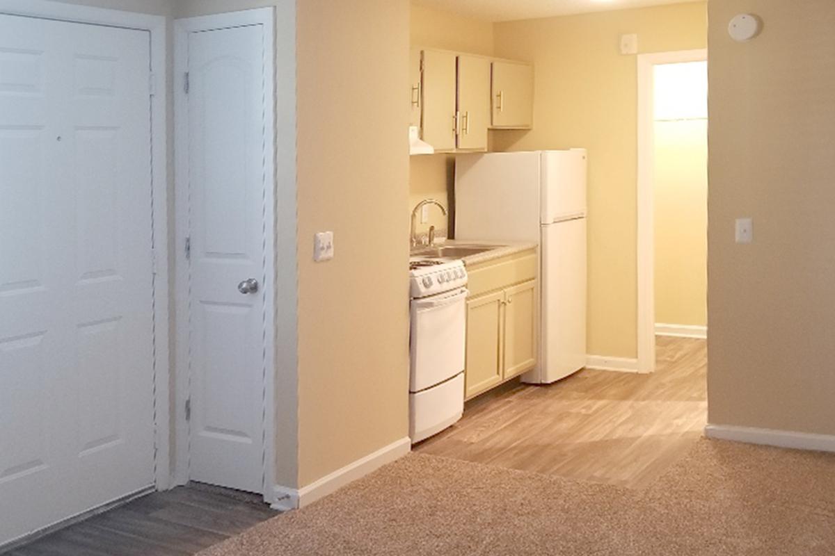 a white refrigerator freezer sitting inside of a building