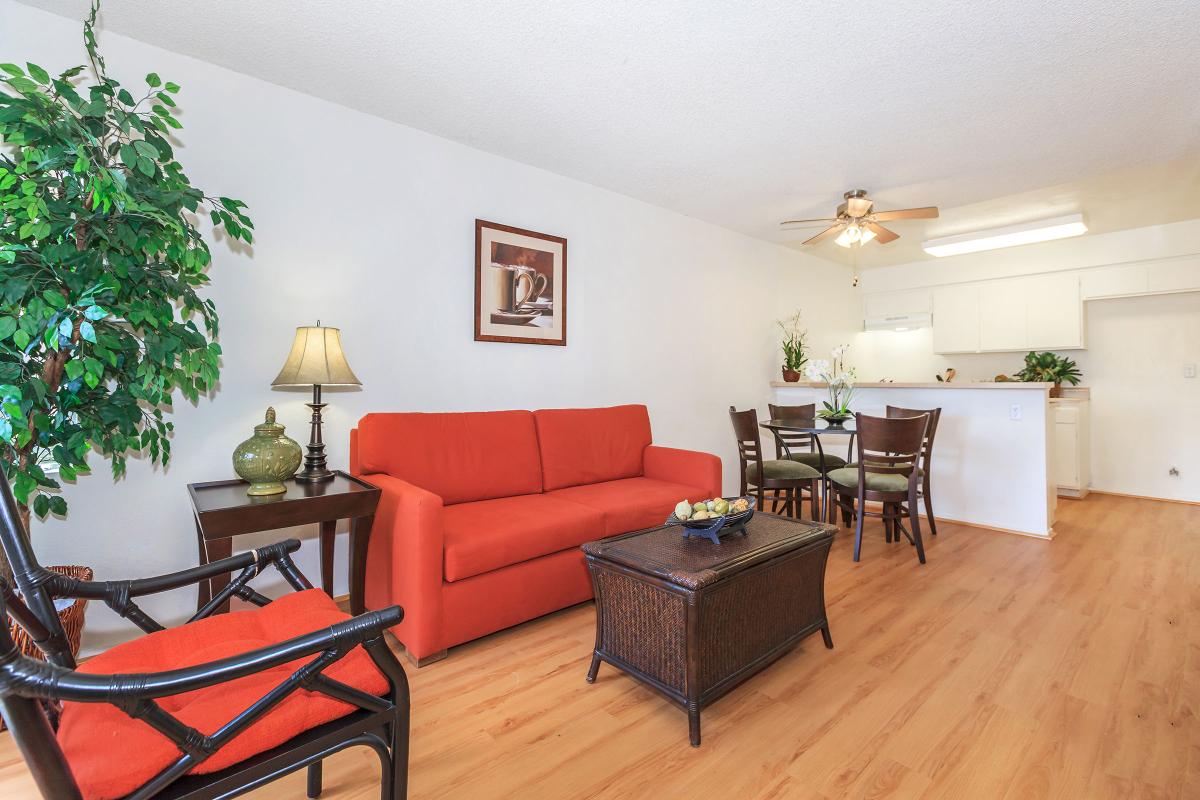 a large red chair in the living room