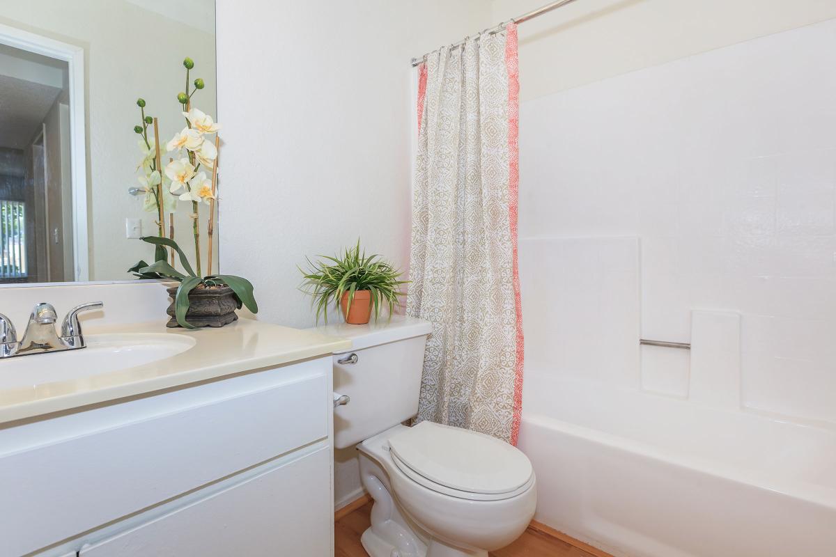 a white tub sitting next to a window