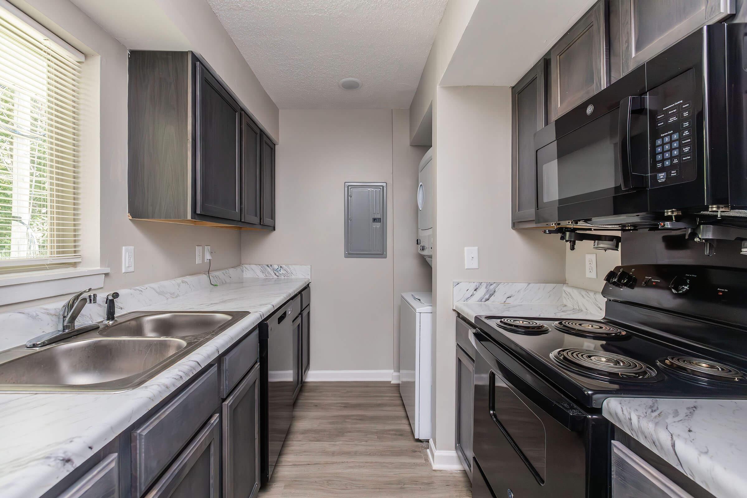 a kitchen with a sink and a window