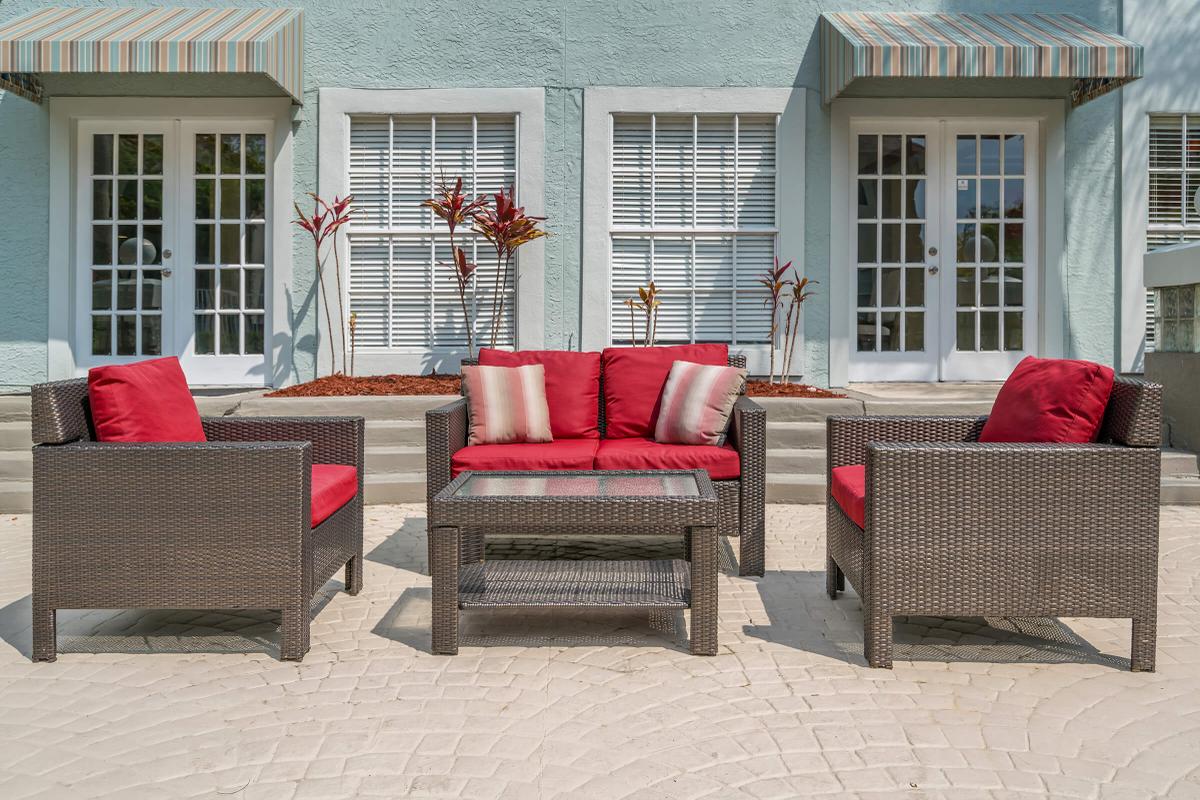 a large red chair in the living room