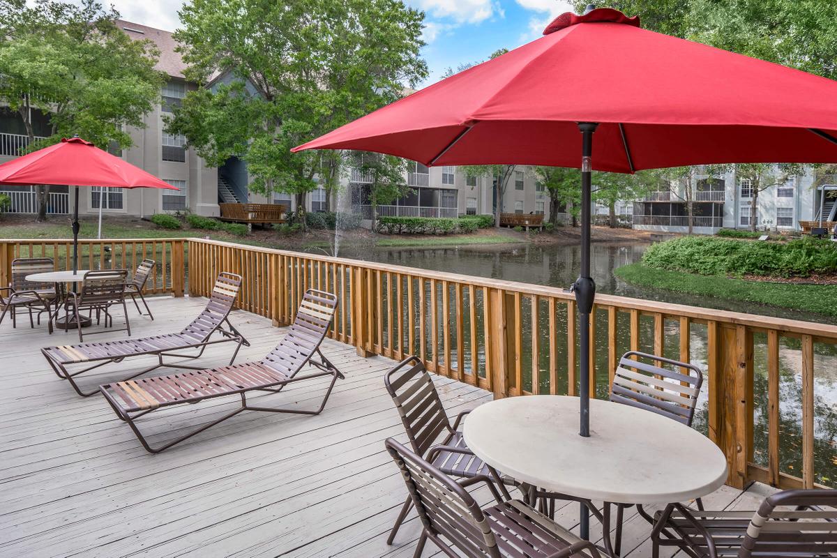 a group of lawn chairs sitting on top of a picnic table