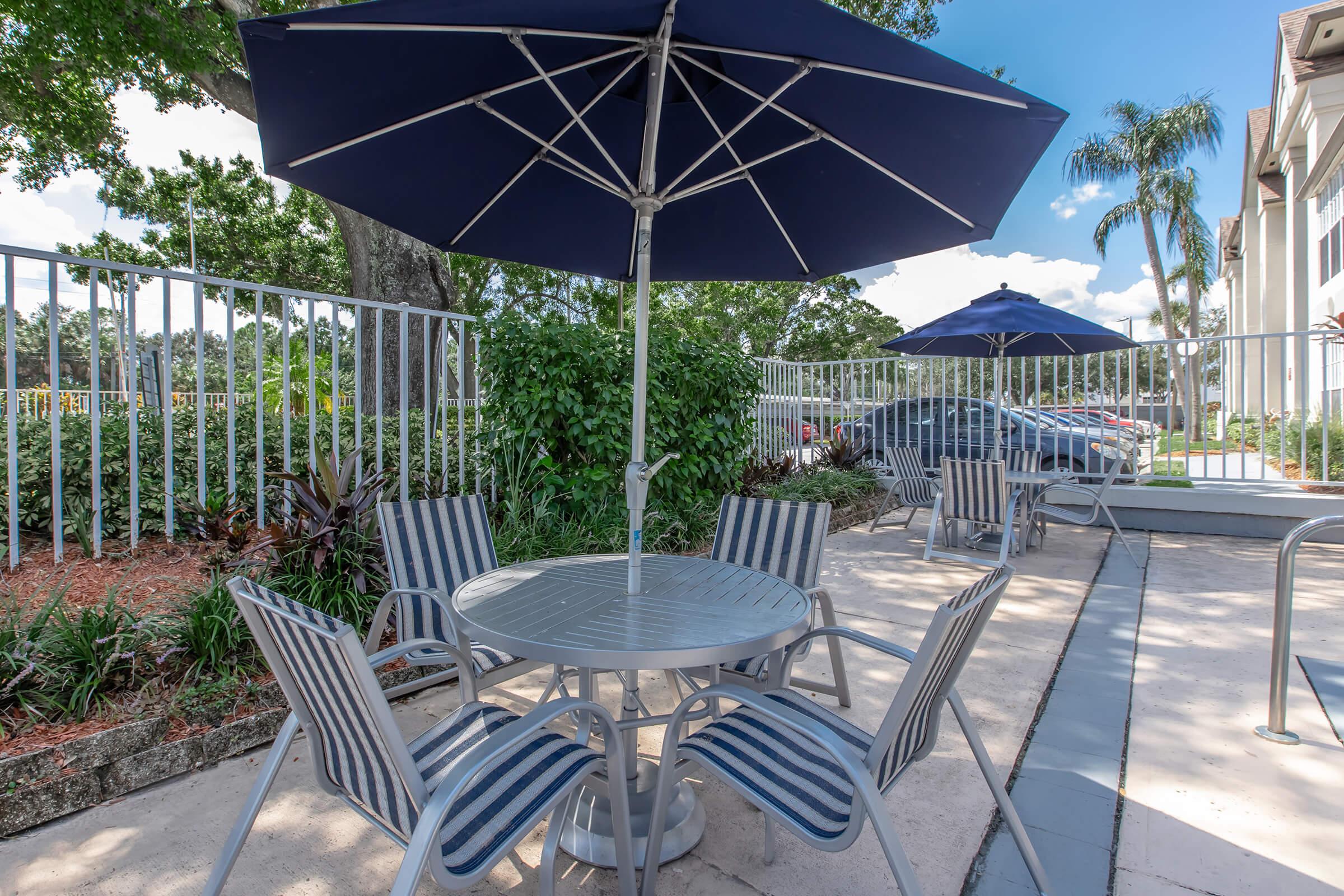 a lawn chair under an umbrella