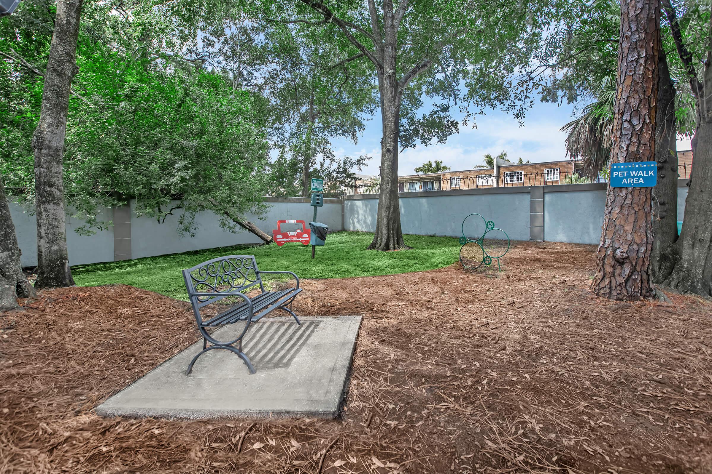 a bench in front of a tree