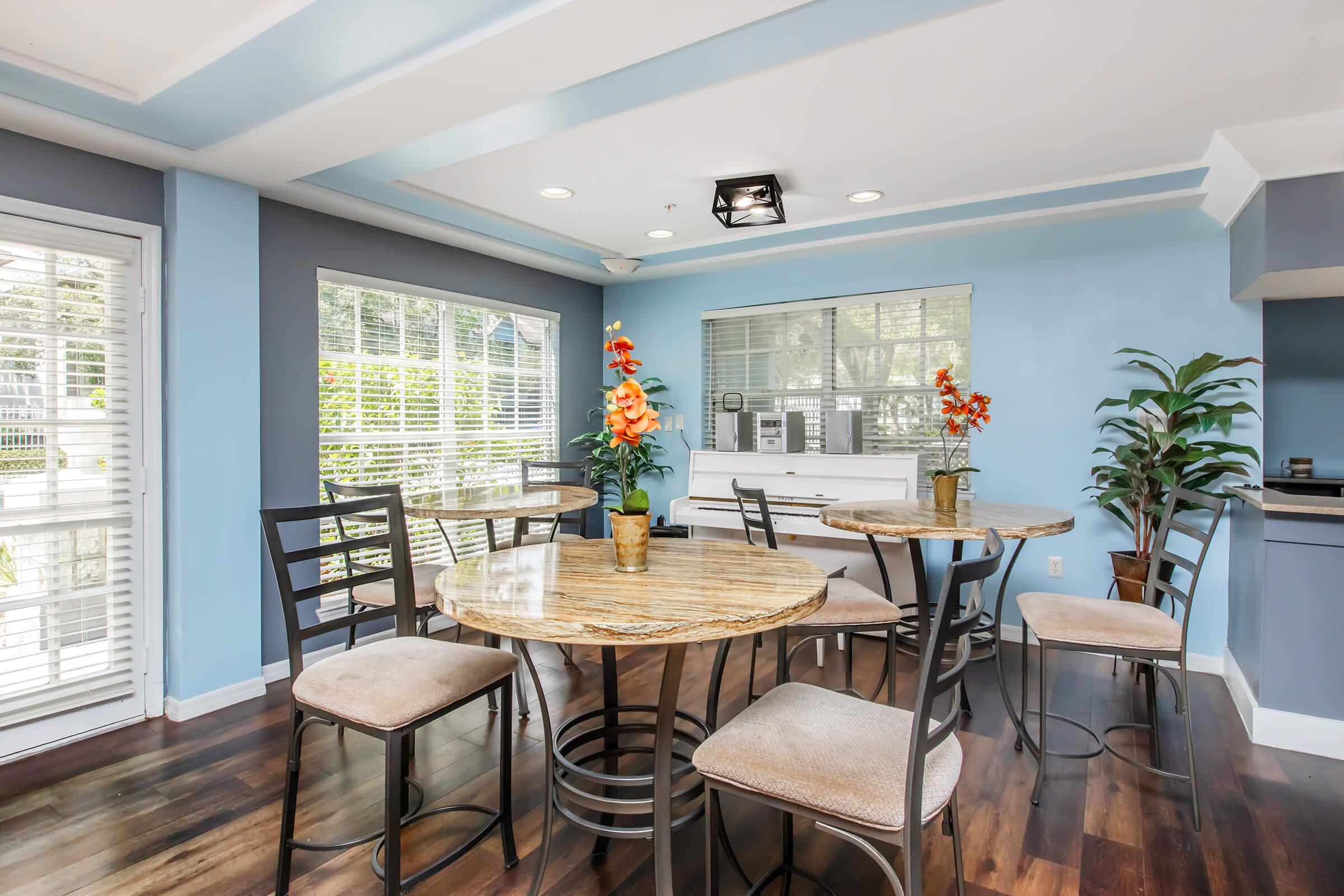 a dining room table in front of a window