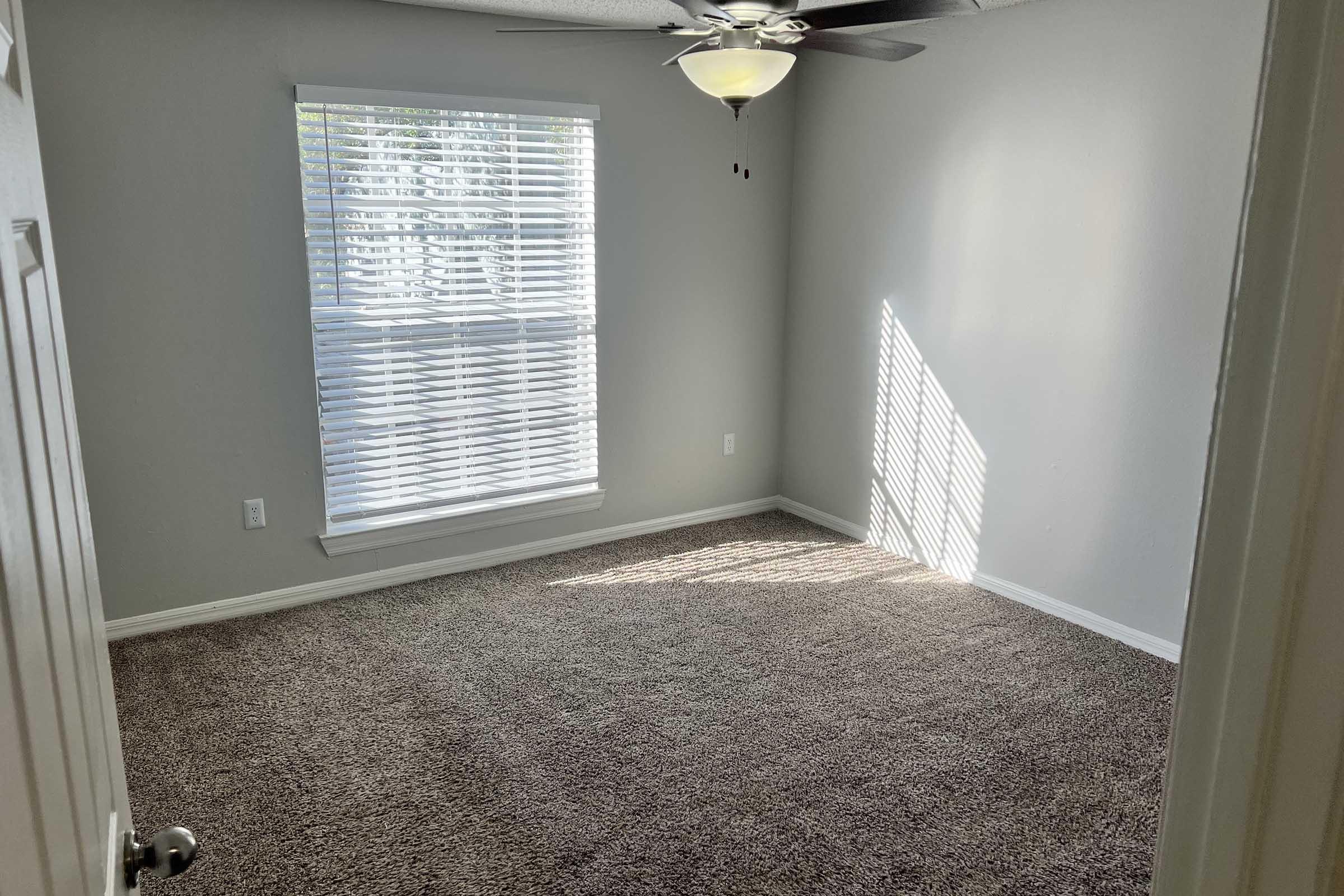 a bedroom with a large mirror