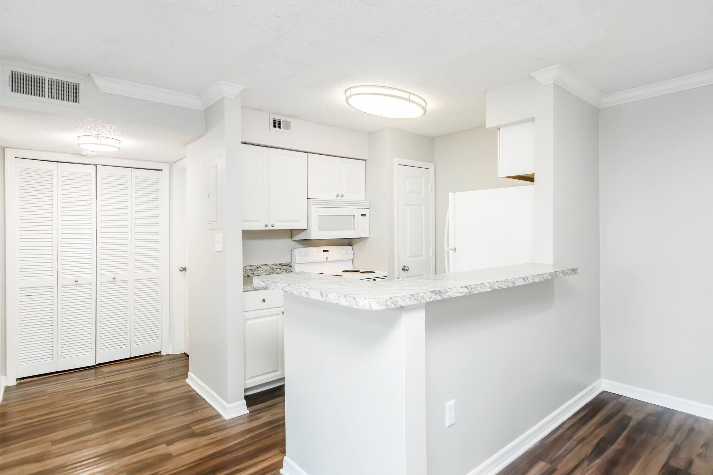 a kitchen with a sink and a window