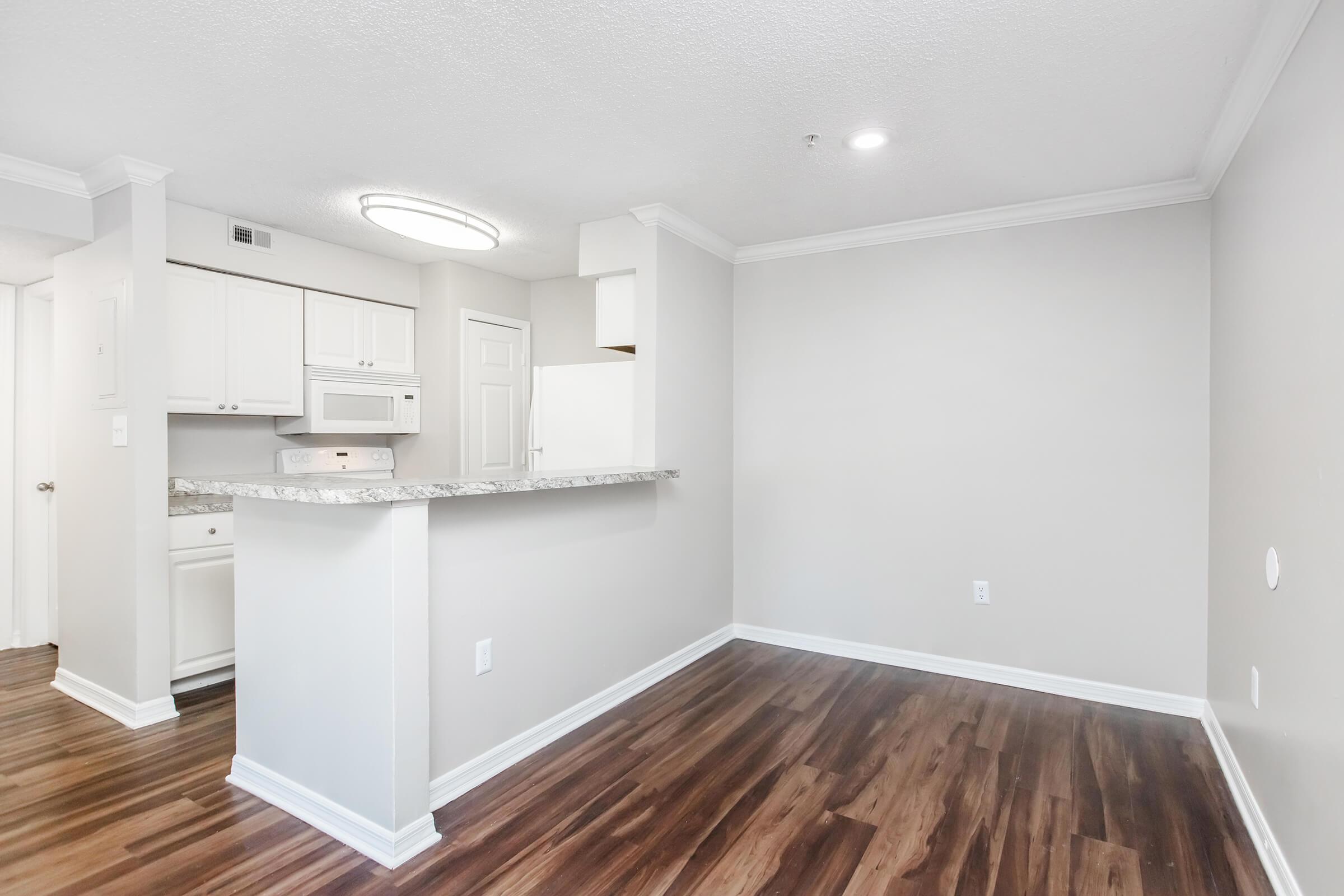 a kitchen with a wood floor